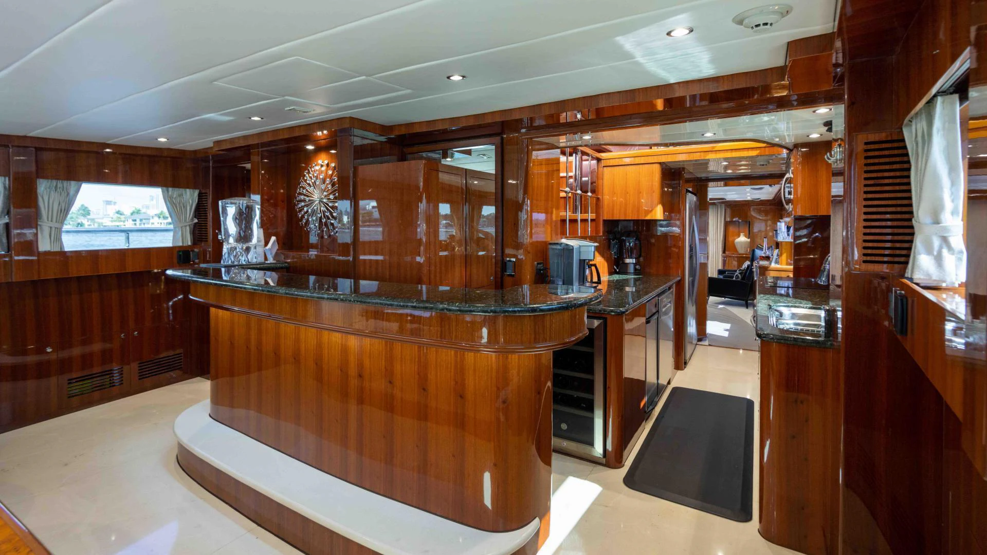 a large bar with a large glass top aboard NEVER SETTLE Yacht for Sale