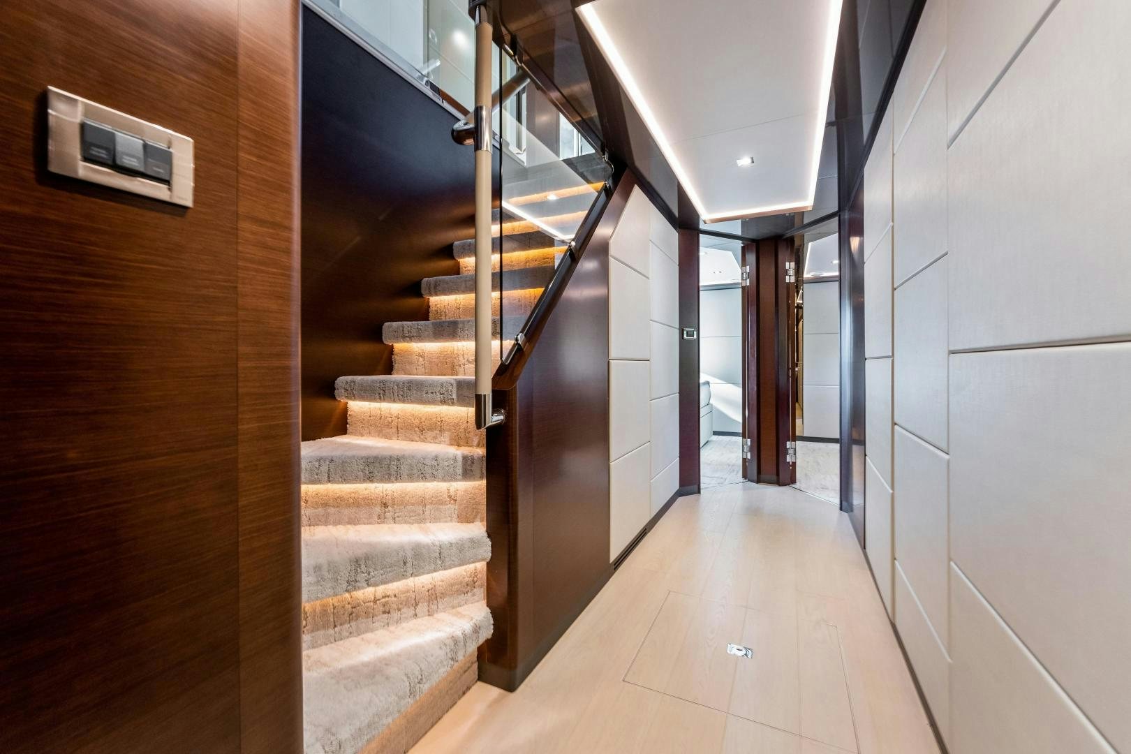 a hallway with a set of stairs aboard LIVING LIFE Yacht for Sale