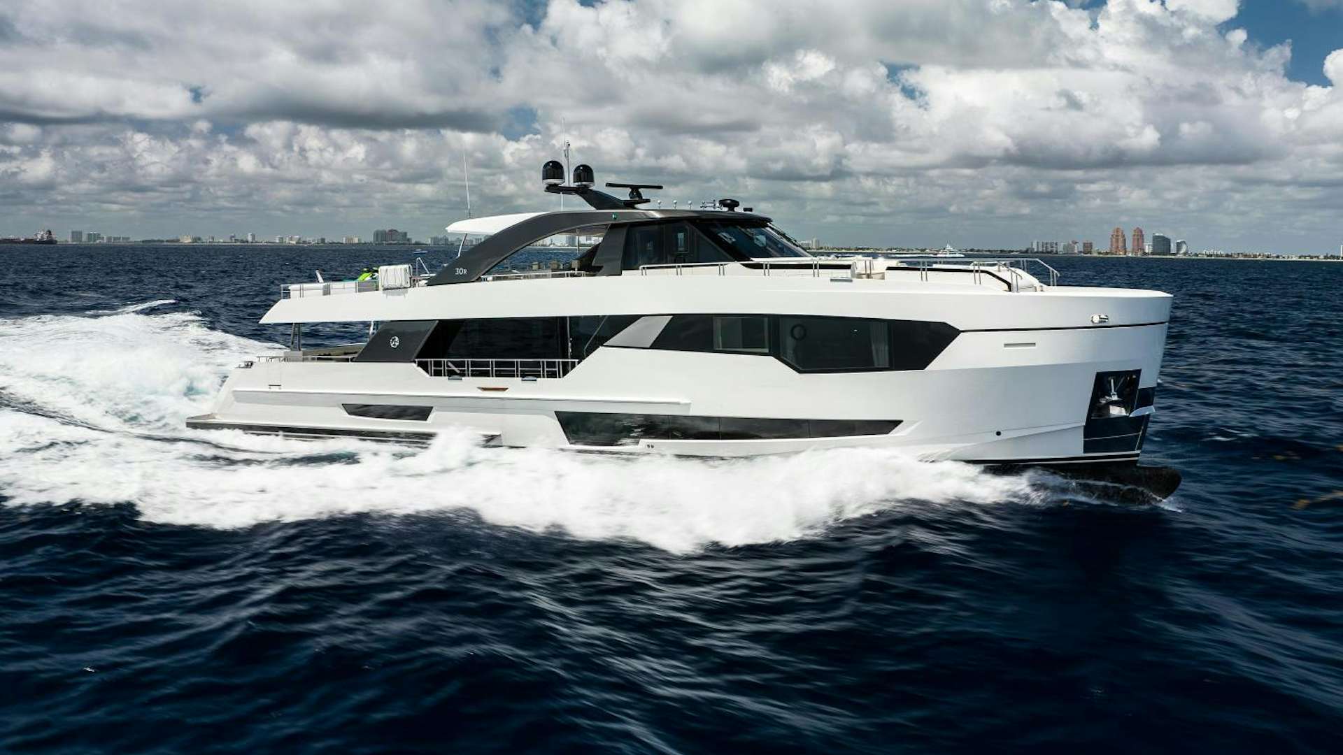 a white boat on water aboard FOURTH DOWN Yacht for Sale