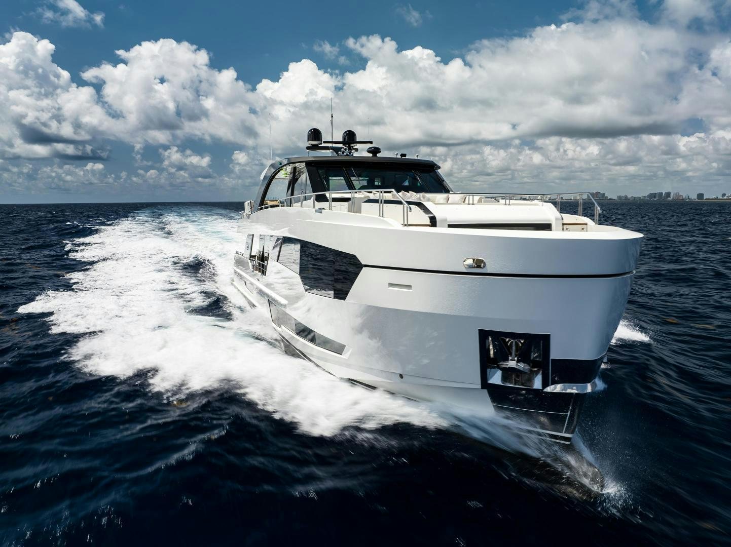 a white boat on the water aboard LIVING LIFE Yacht for Sale
