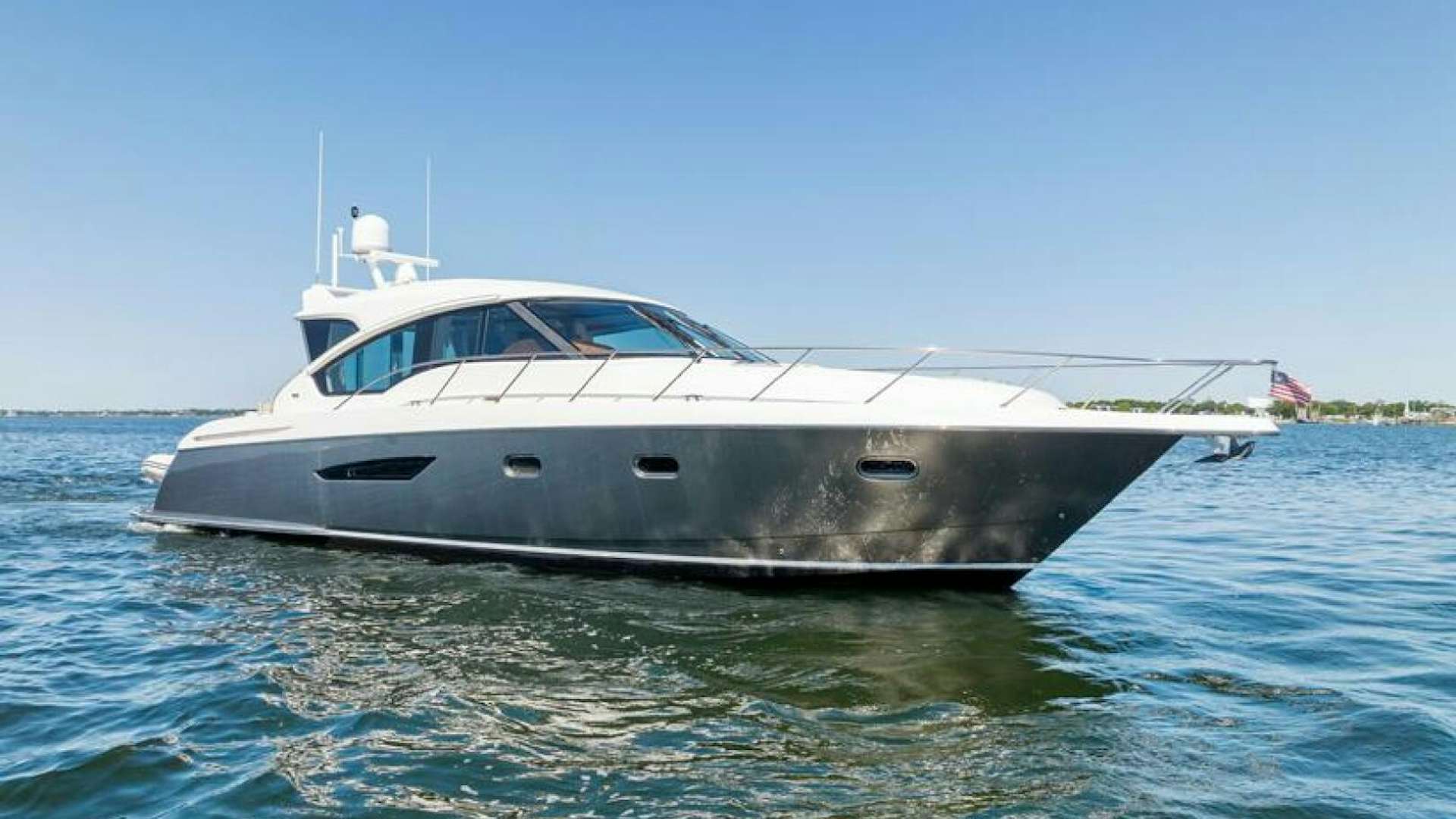 a white yacht in the water aboard WATERS EDGE Yacht for Sale