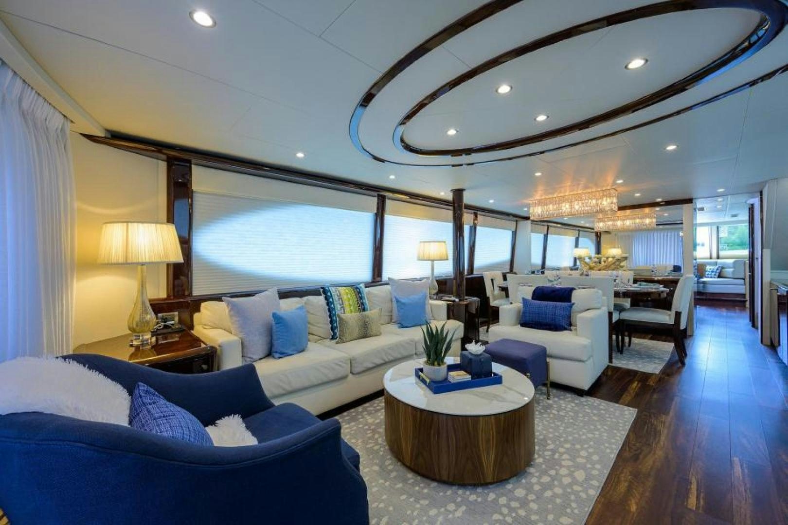 a large living room with a large ceiling aboard GYPSEA Yacht for Sale
