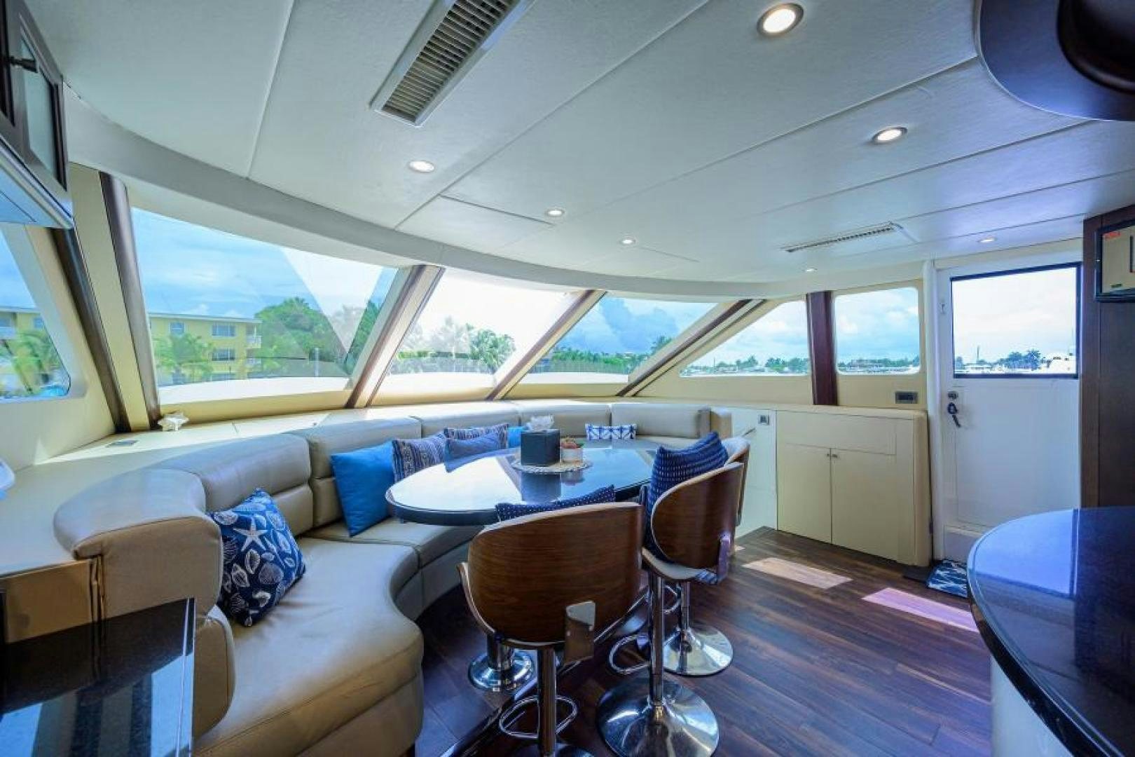 a living room with a couch and a table aboard GYPSEA Yacht for Sale