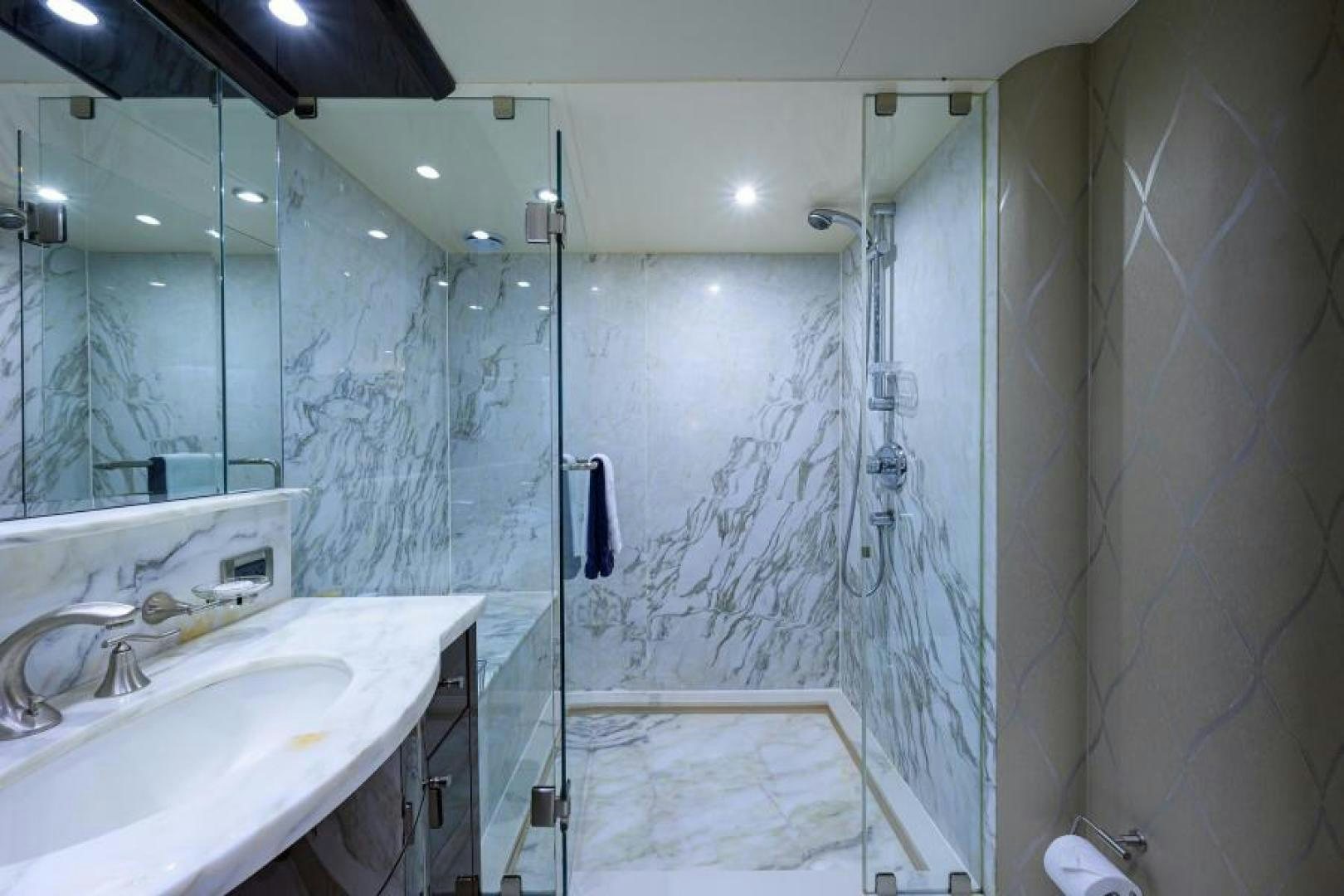a bathroom with a shower and sink aboard GYPSEA Yacht for Sale