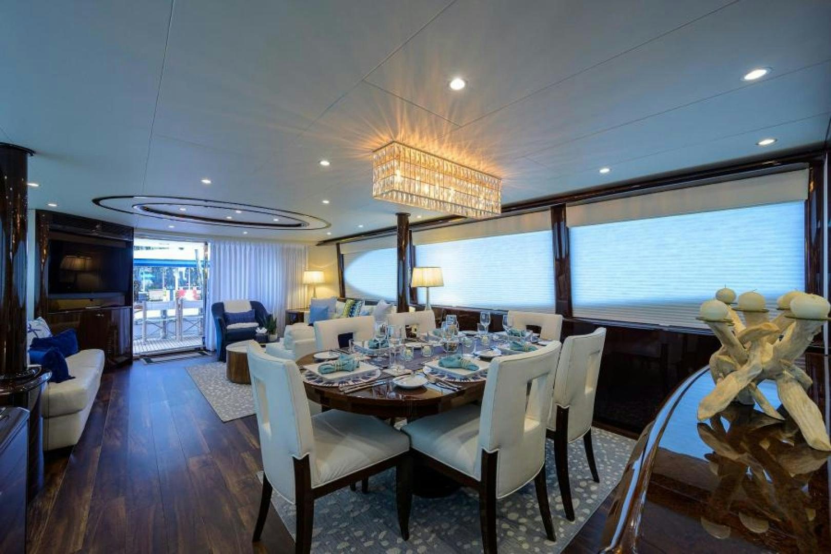 a dining room with a large table and chairs aboard GYPSEA Yacht for Sale