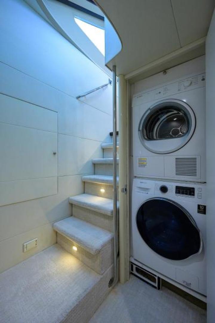 a laundry room with a washing machine aboard GYPSEA Yacht for Sale