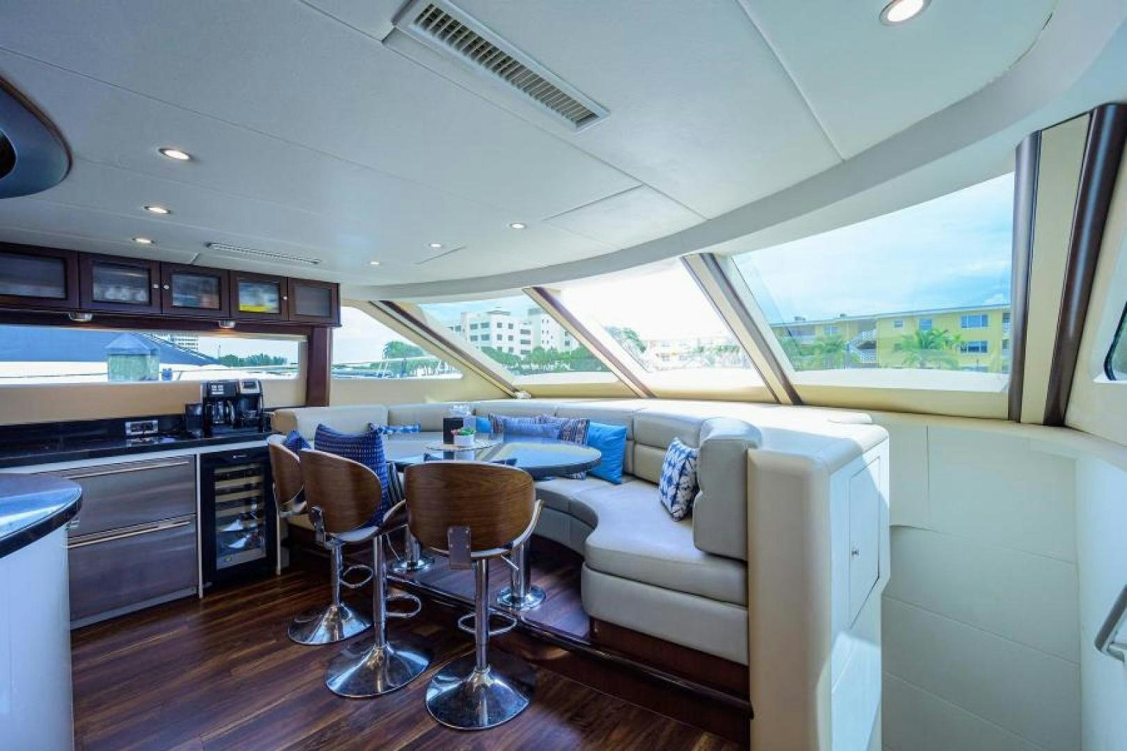 a living room with a couch and a table aboard GYPSEA Yacht for Sale