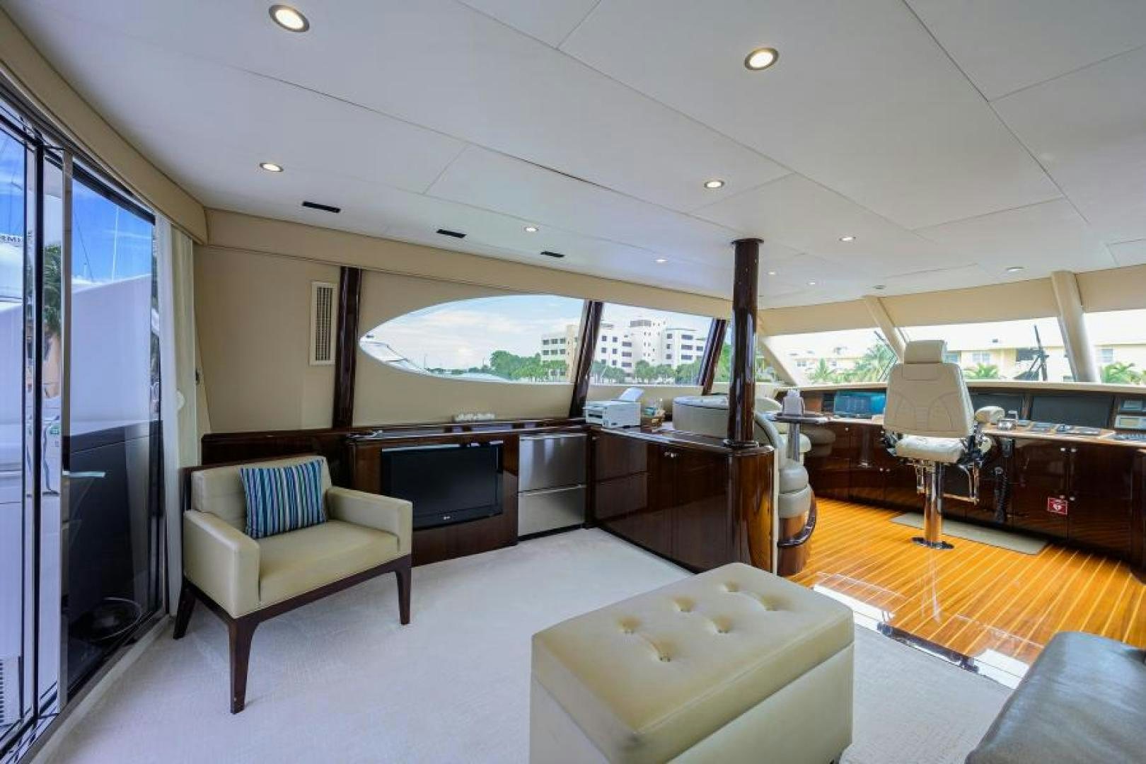 a room with a couch and a television aboard GYPSEA Yacht for Sale