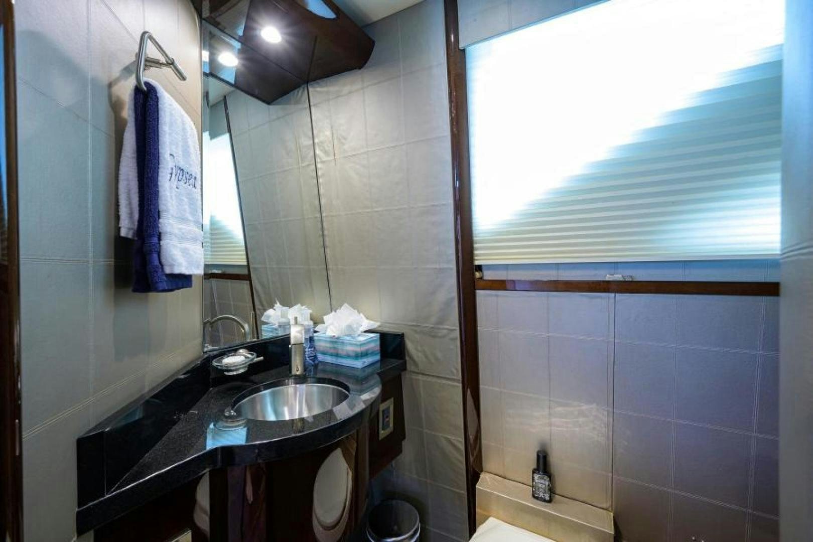a bathroom with a sink and a mirror aboard GYPSEA Yacht for Sale