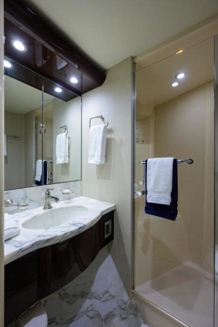 a bathroom with a large mirror aboard GYPSEA Yacht for Sale