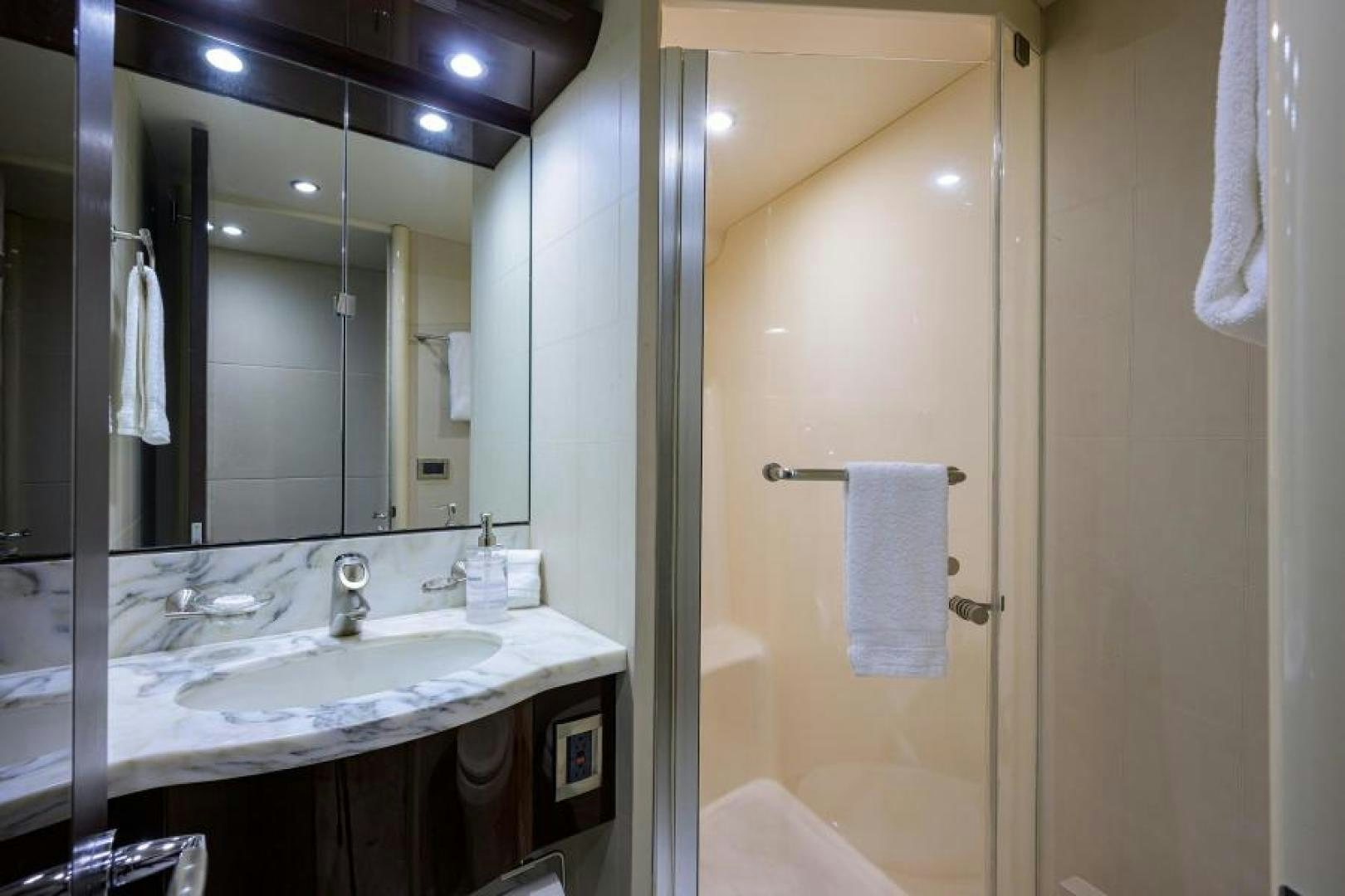 a bathroom with a large mirror aboard GYPSEA Yacht for Sale