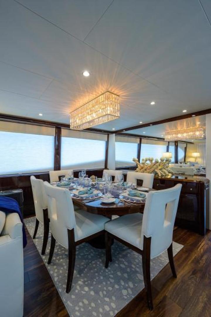 a dining room with a table and chairs aboard GYPSEA Yacht for Sale