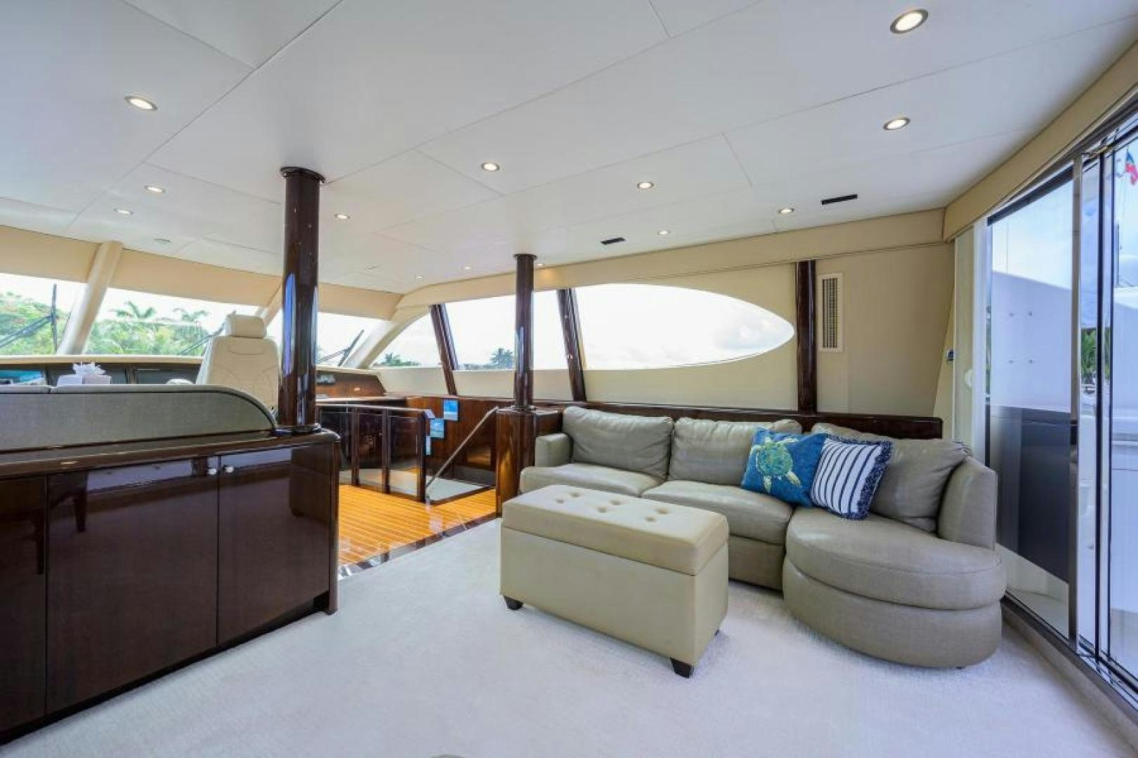 a living room with a couch and a table aboard GYPSEA Yacht for Sale