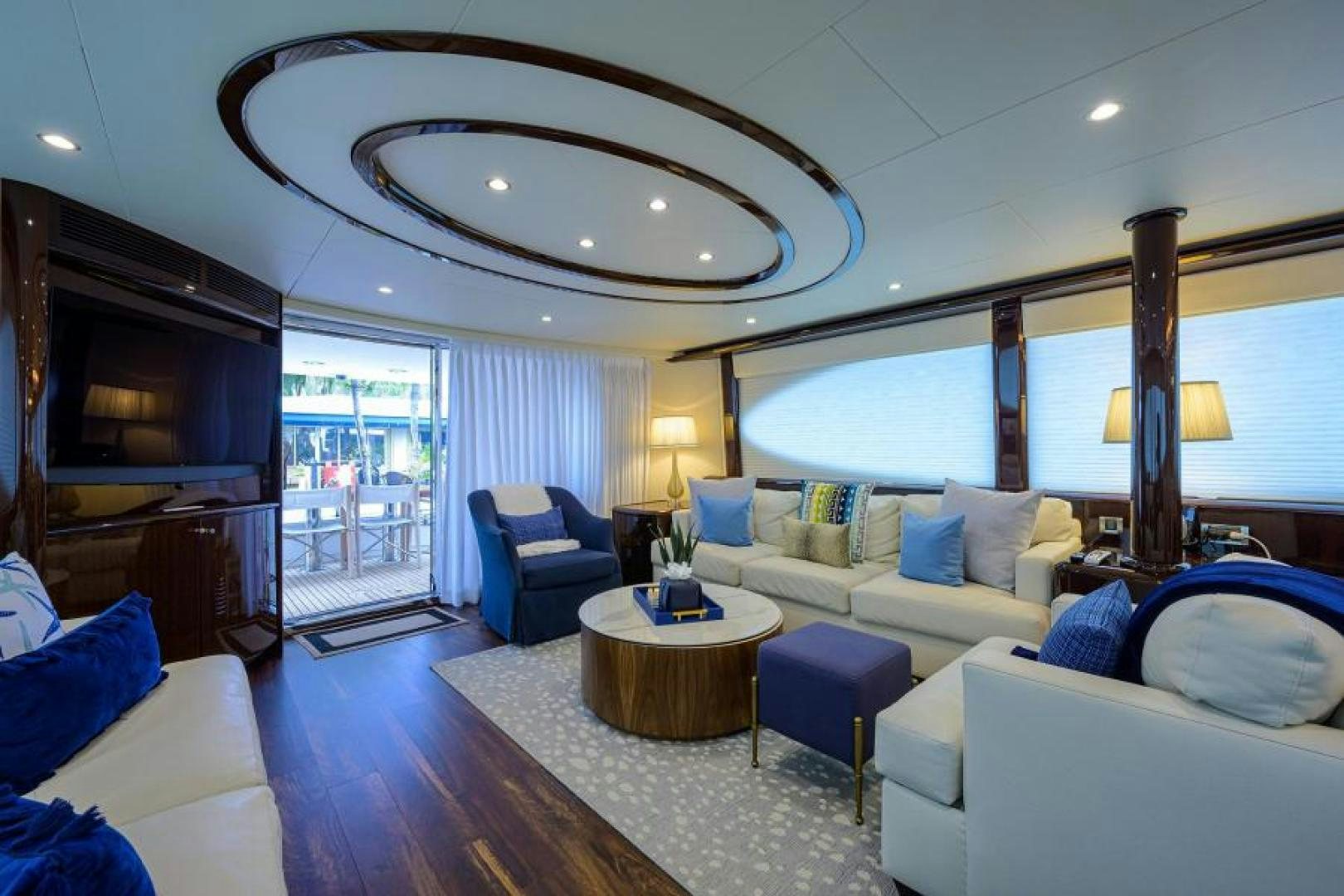 a living room with a large window aboard GYPSEA Yacht for Sale