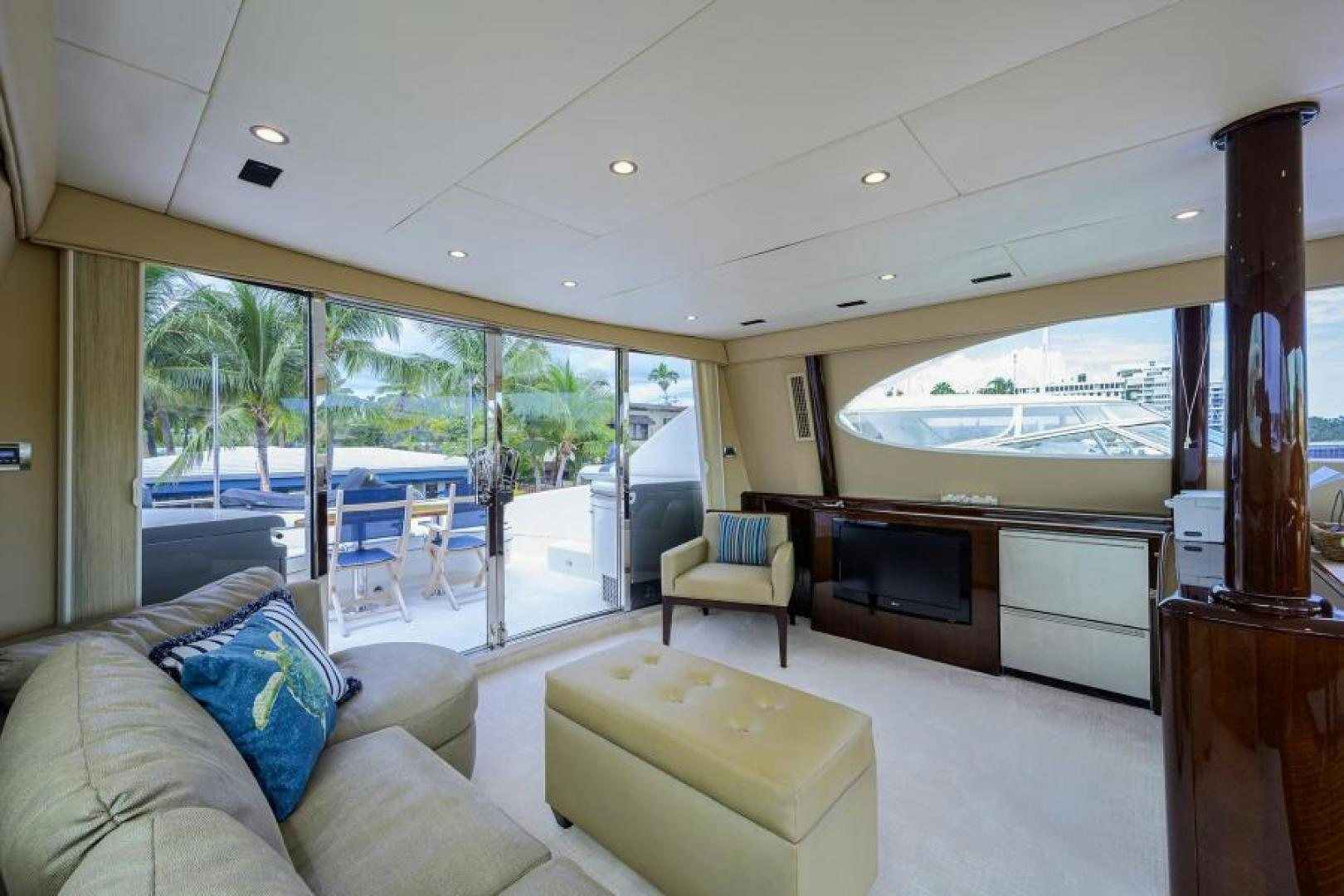 a living room with a large window aboard GYPSEA Yacht for Sale