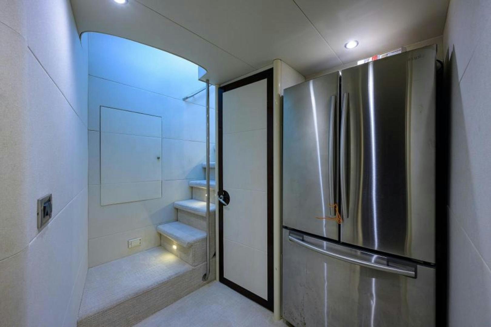 a room with a large refrigerator aboard GYPSEA Yacht for Sale
