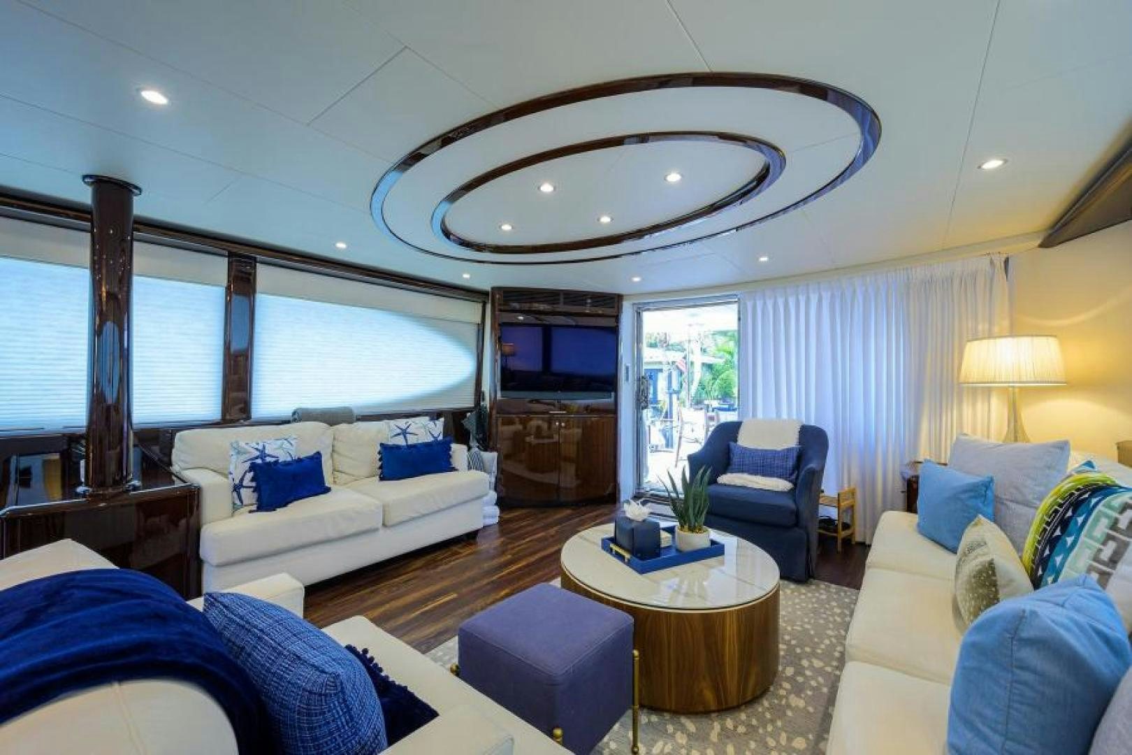 a living room with a large chandelier aboard GYPSEA Yacht for Sale