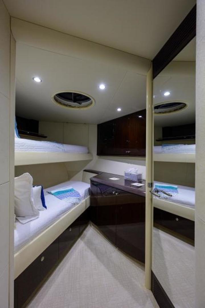 a room with a bed and a mirror aboard GYPSEA Yacht for Sale