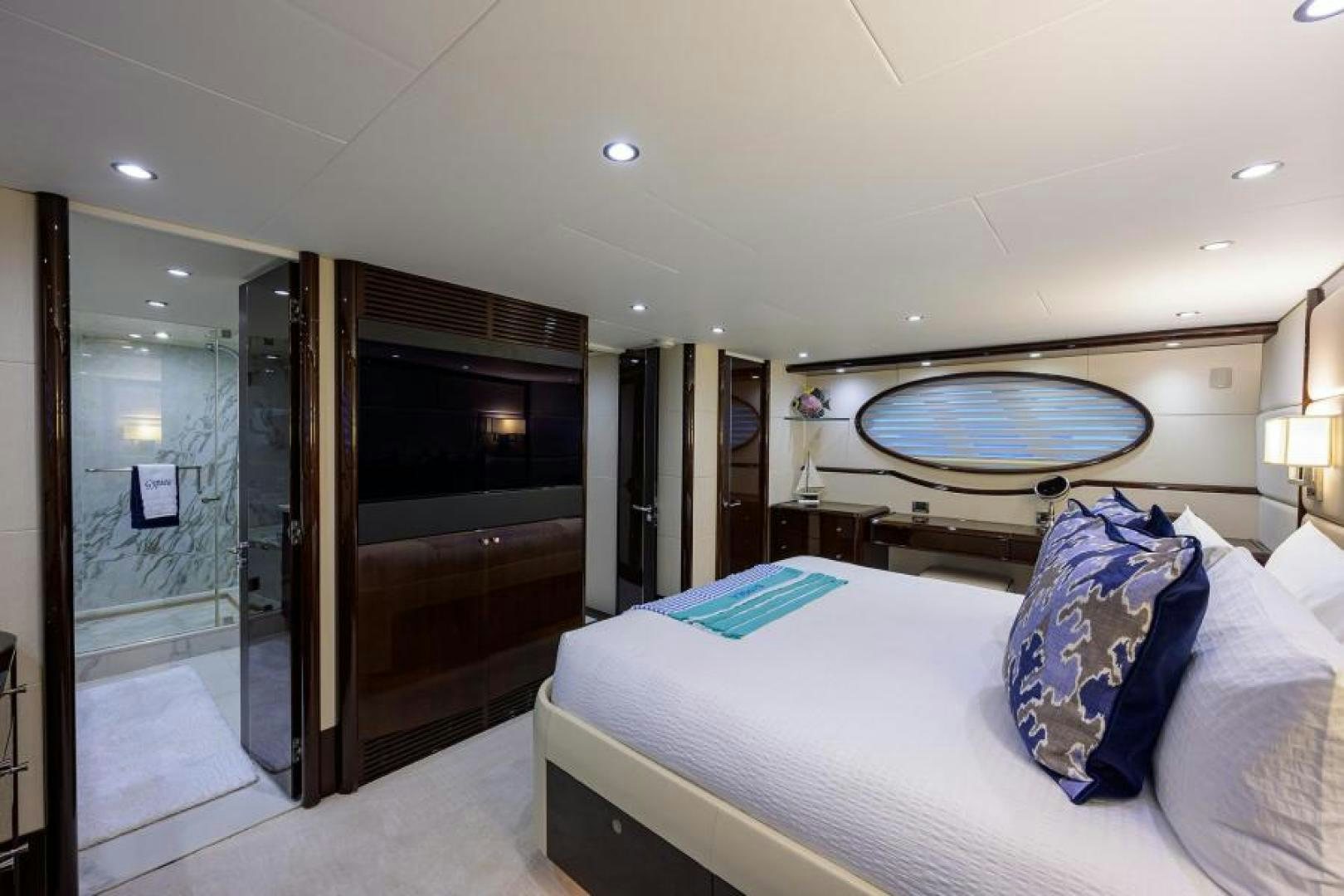 a bedroom with a large mirror aboard GYPSEA Yacht for Sale