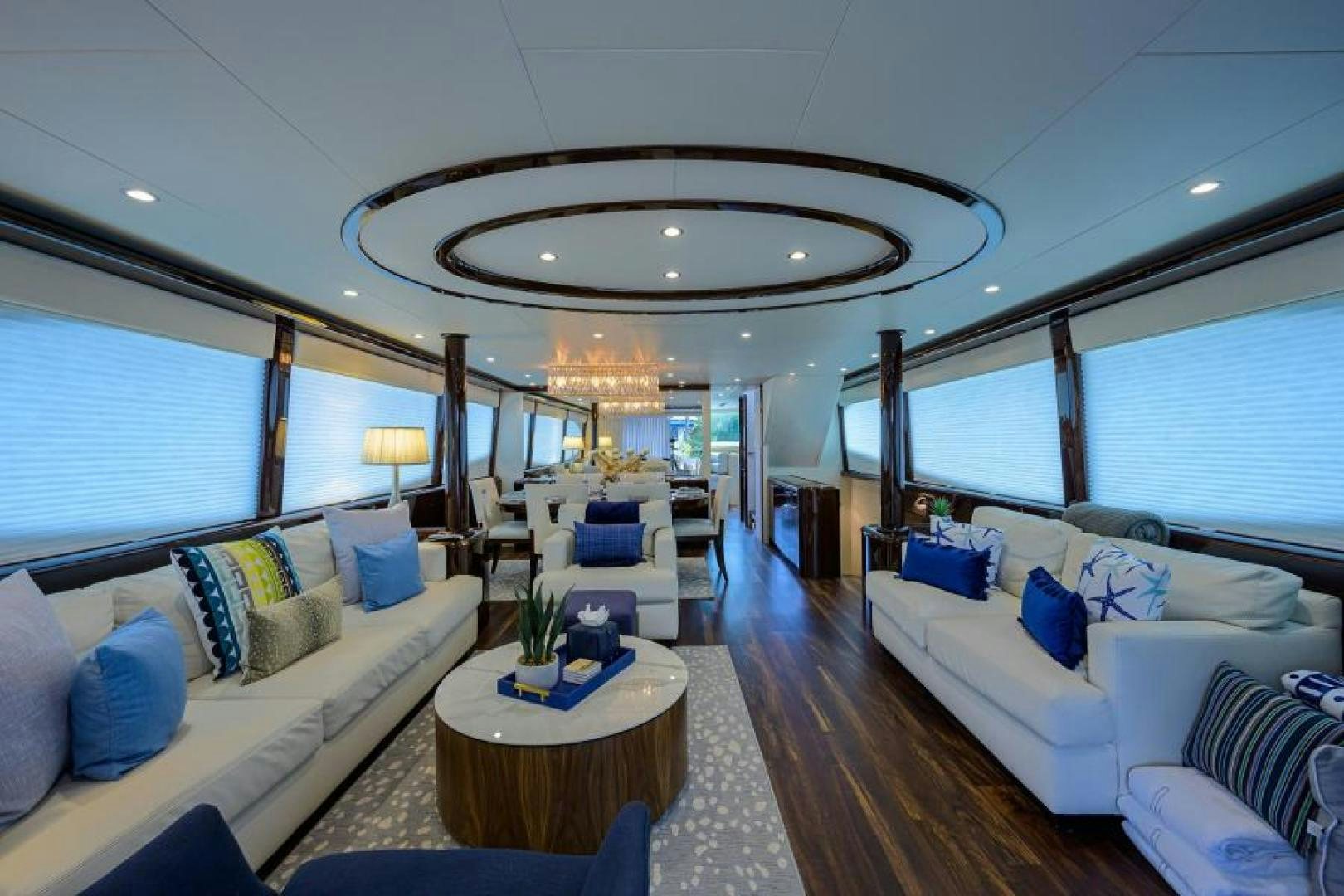 a living room with a large chandelier aboard GYPSEA Yacht for Sale