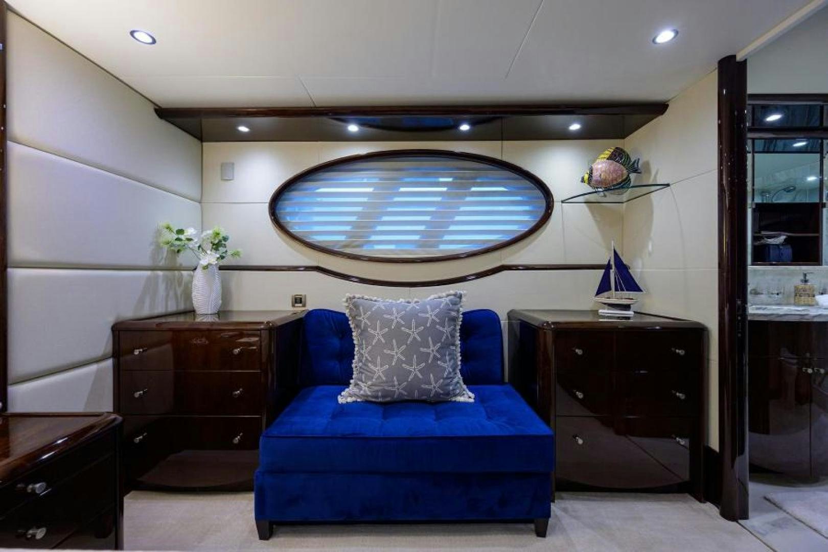 a blue couch in a room aboard GYPSEA Yacht for Sale
