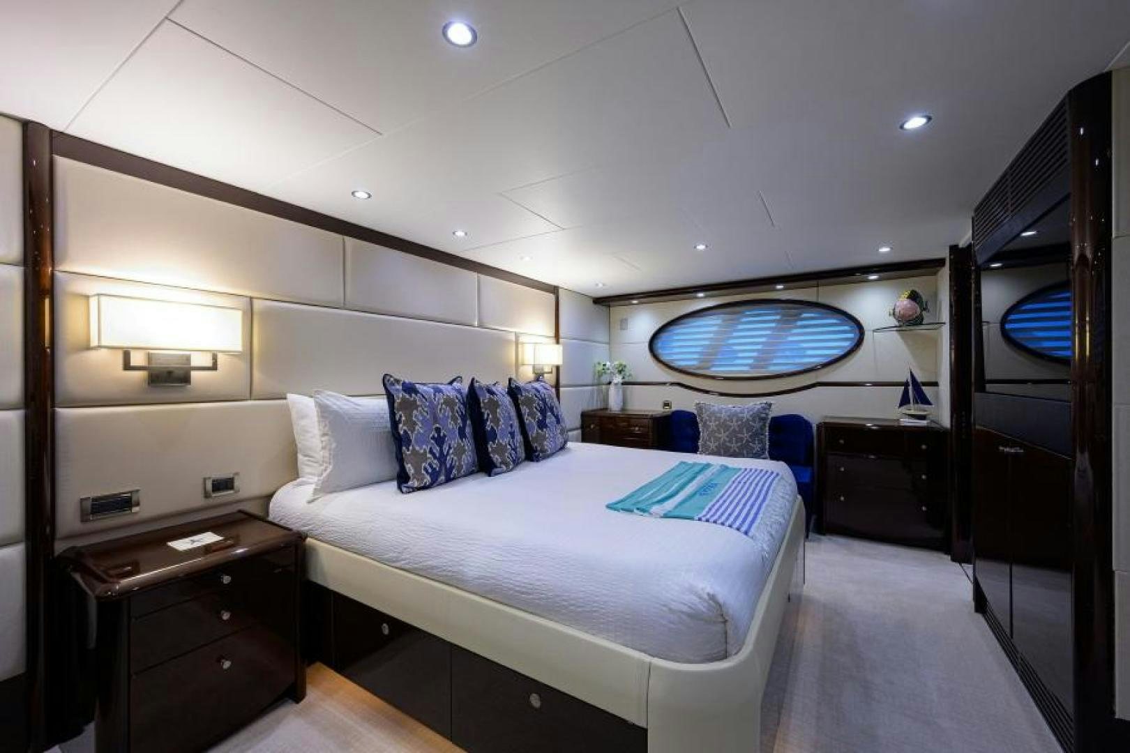 a bedroom with a large mirror aboard GYPSEA Yacht for Sale