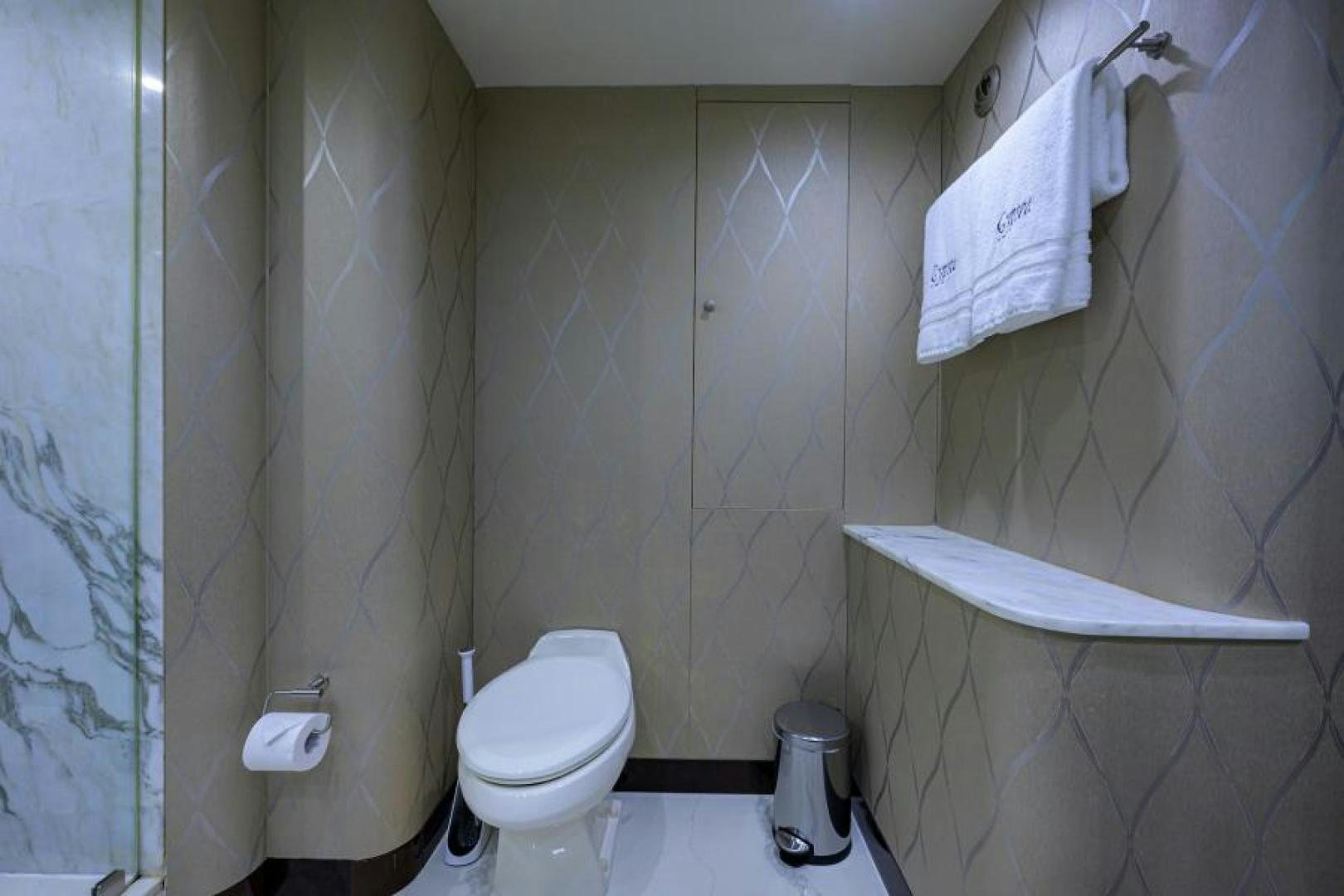 a bathroom with a toilet and a bathtub aboard GYPSEA Yacht for Sale