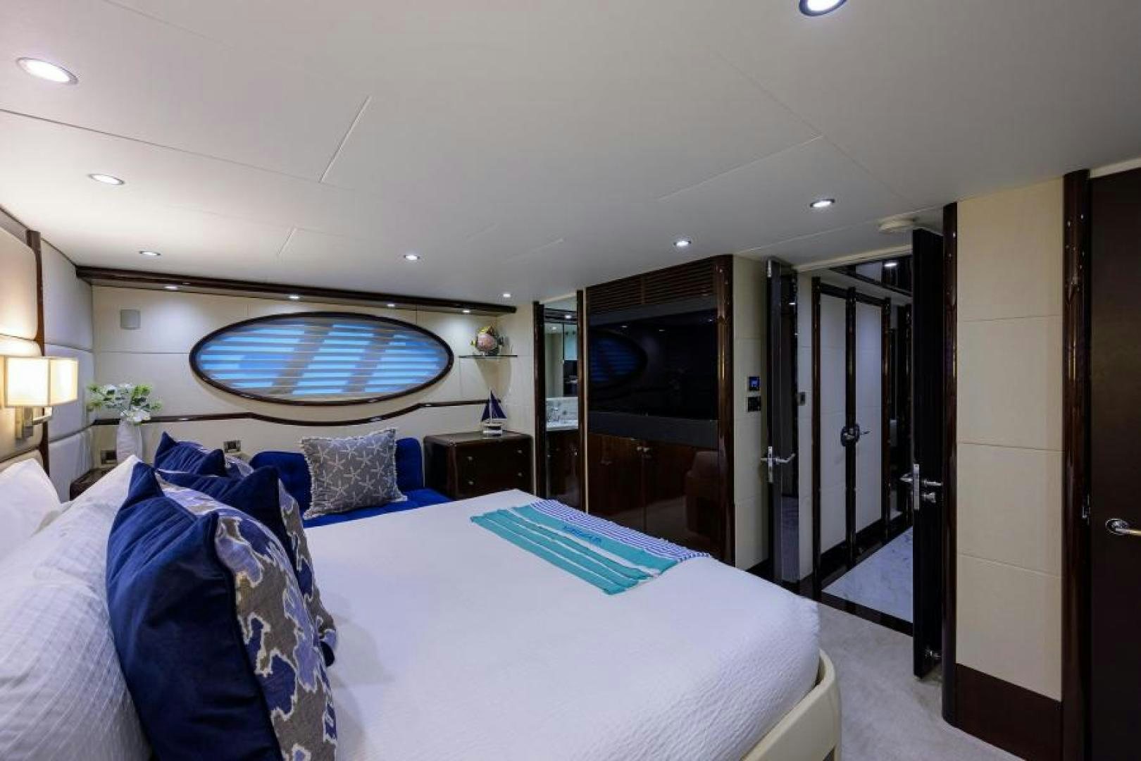 a hotel room with a large bed aboard GYPSEA Yacht for Sale