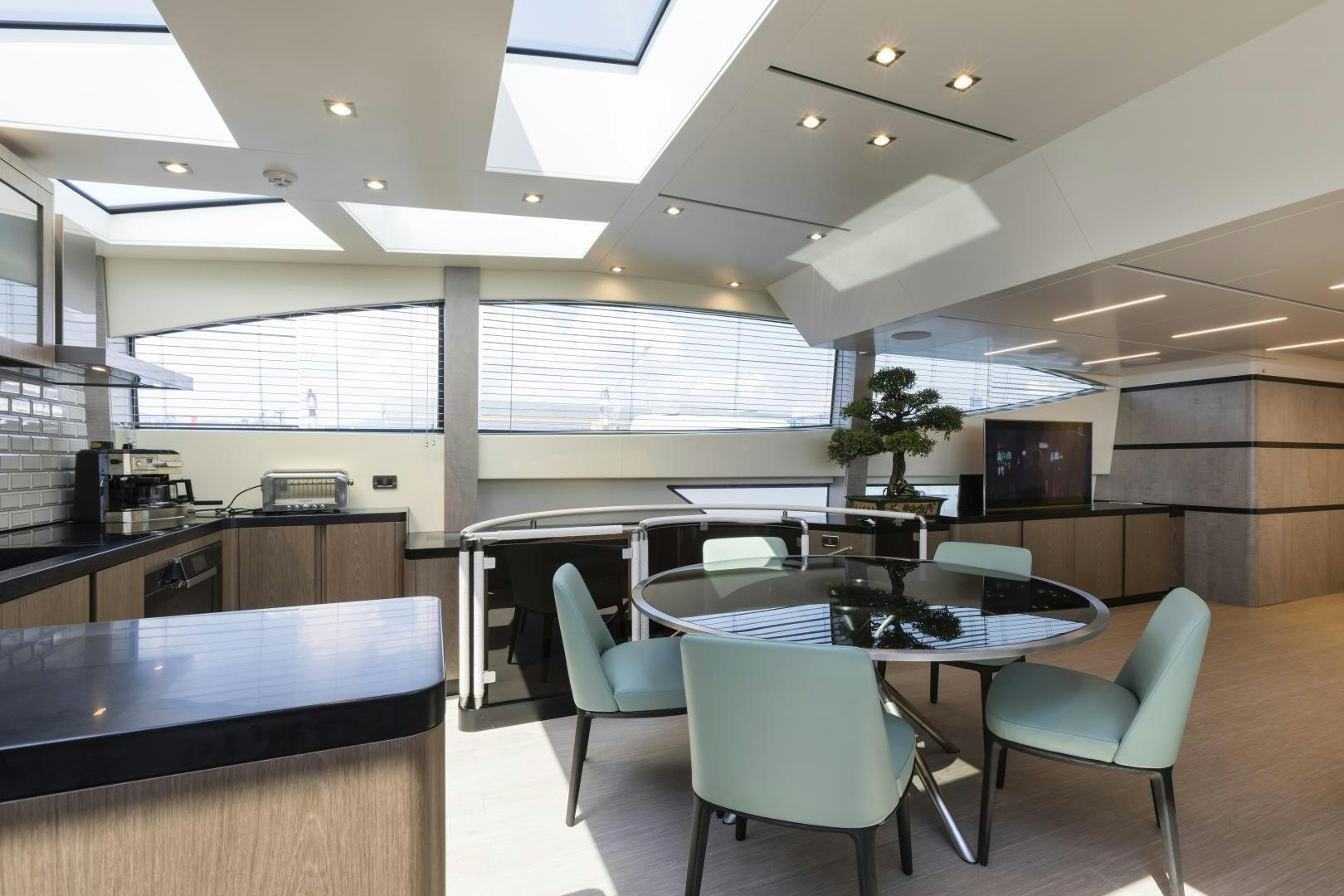 a room with a table and chairs aboard FRANCESCA Yacht for Sale