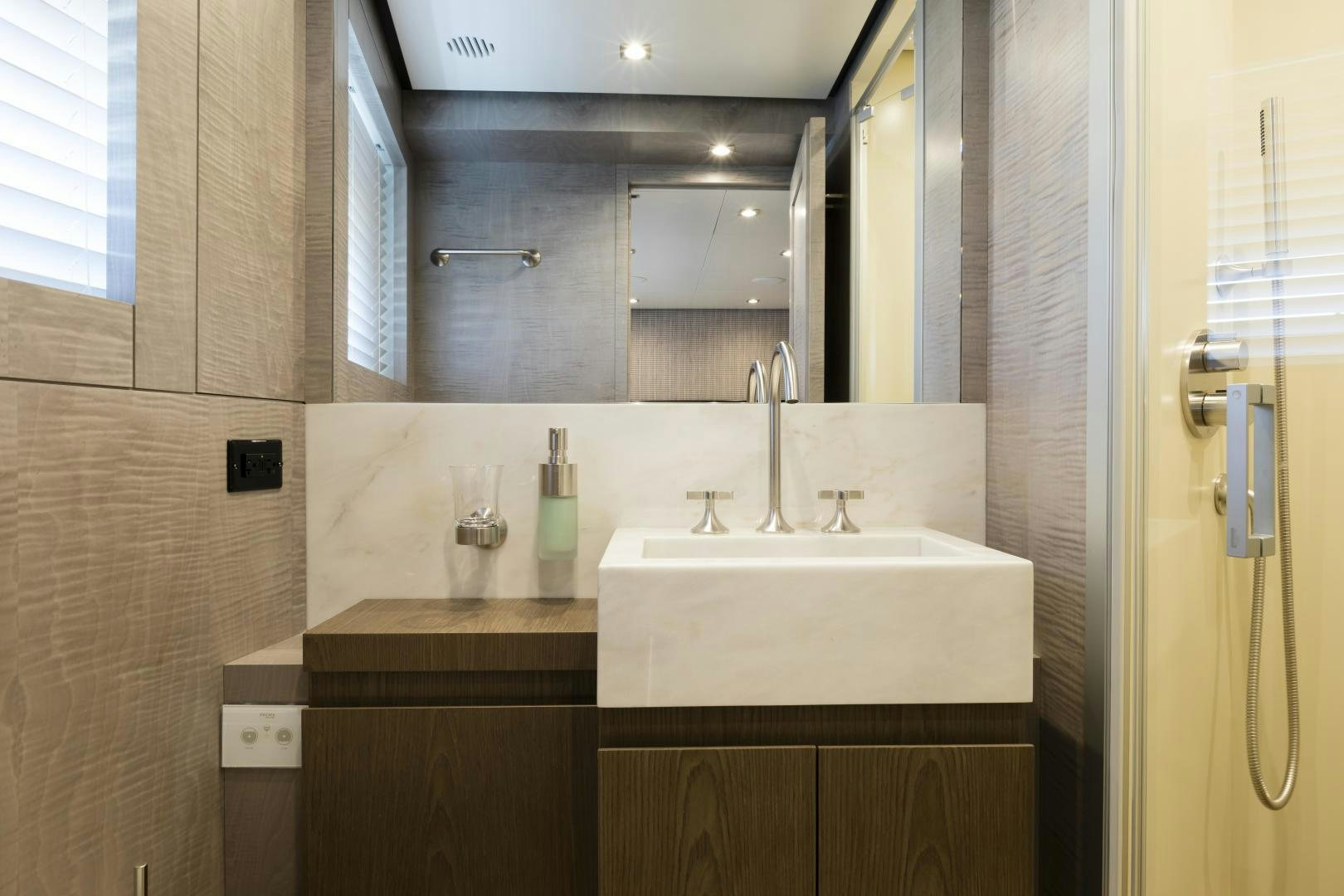 a bathroom with a large mirror aboard FRANCESCA Yacht for Sale