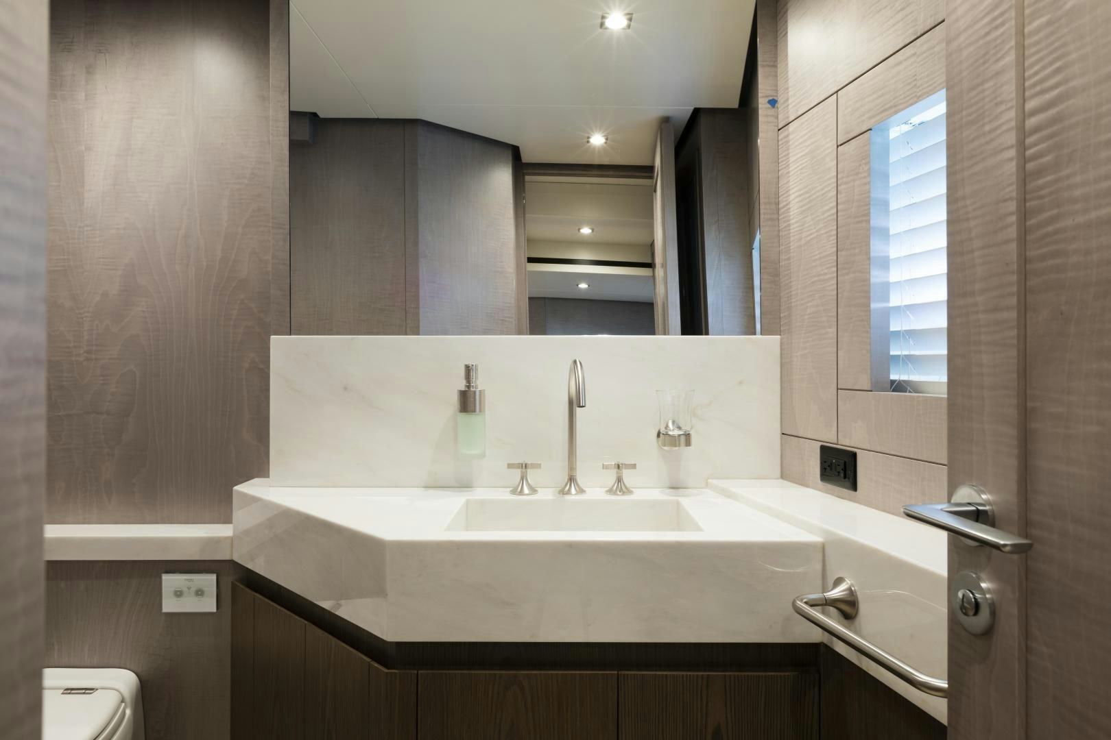 a bathroom with a sink and a mirror aboard FRANCESCA Yacht for Sale
