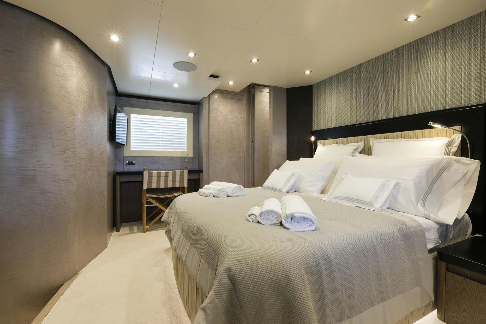 a room with a bed and a chair aboard FRANCESCA Yacht for Sale