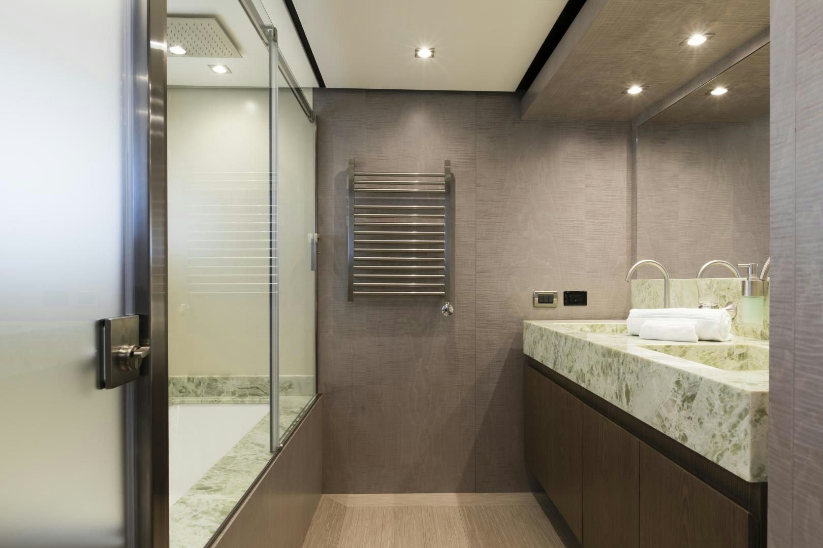 a bathroom with a countertop sink and a shower unit aboard FRANCESCA Yacht for Sale