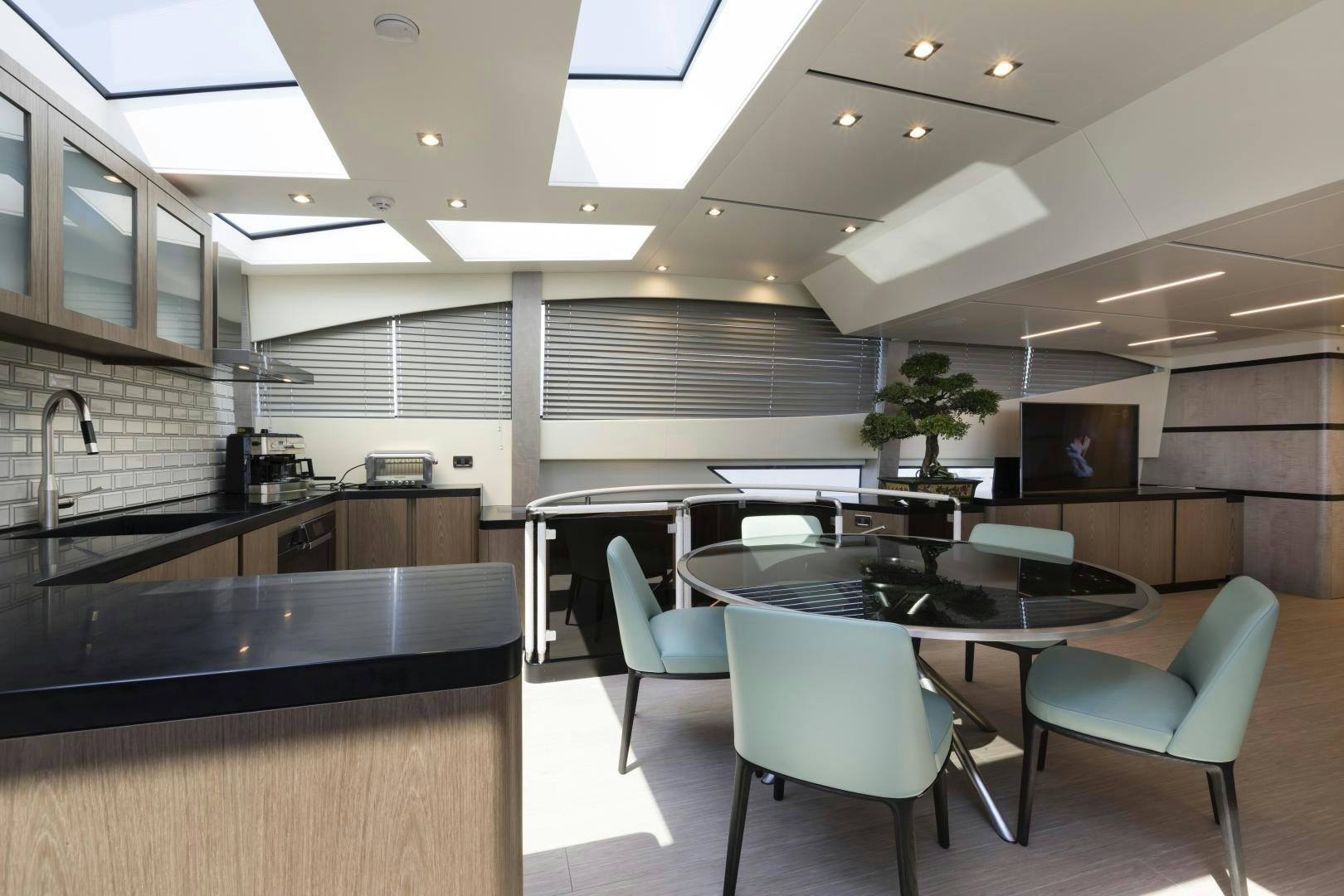 a kitchen with a table and chairs aboard FRANCESCA Yacht for Sale