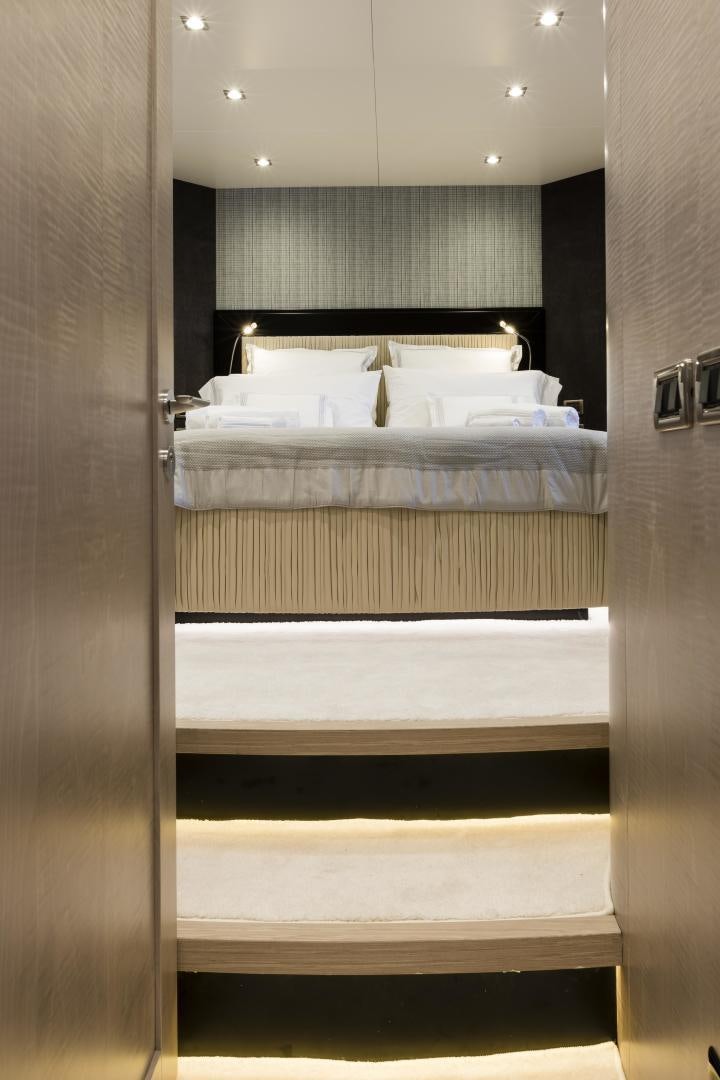 a room with a bed and a mirror aboard FRANCESCA Yacht for Sale