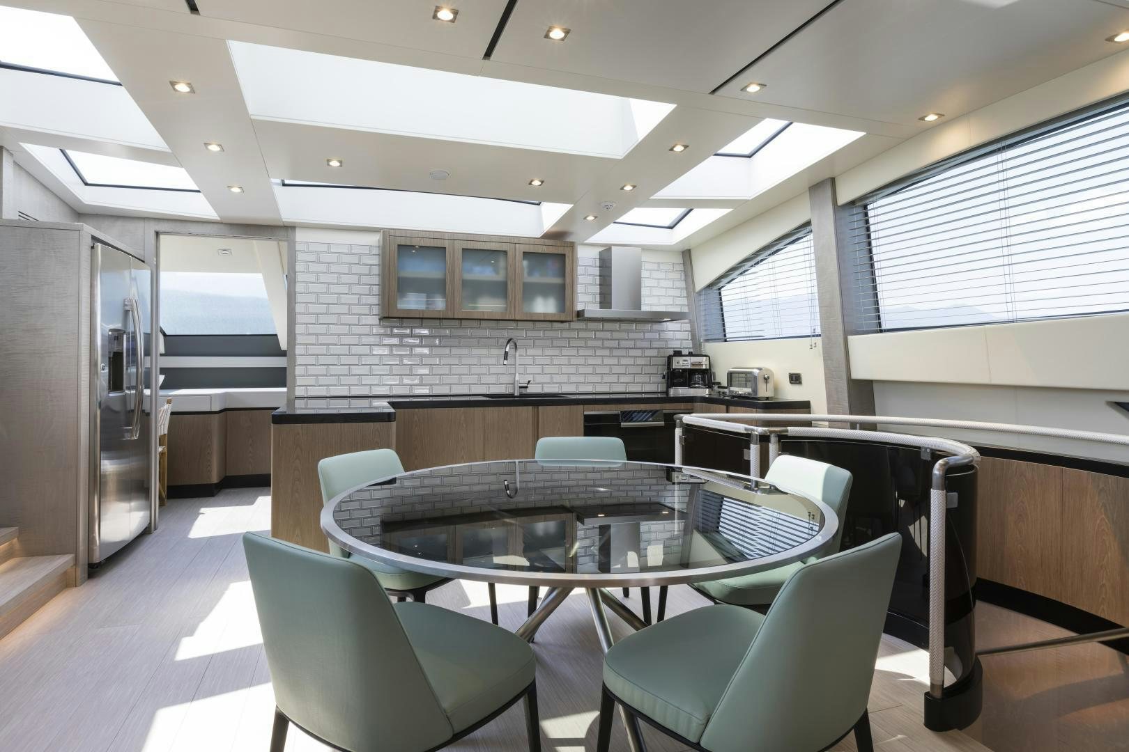 a room with a table and chairs aboard FRANCESCA Yacht for Sale