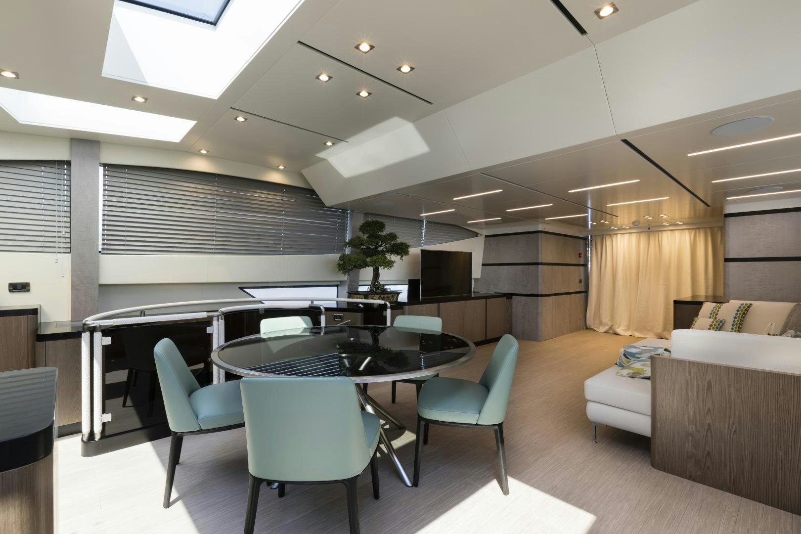 a room with a table and chairs aboard FRANCESCA Yacht for Sale