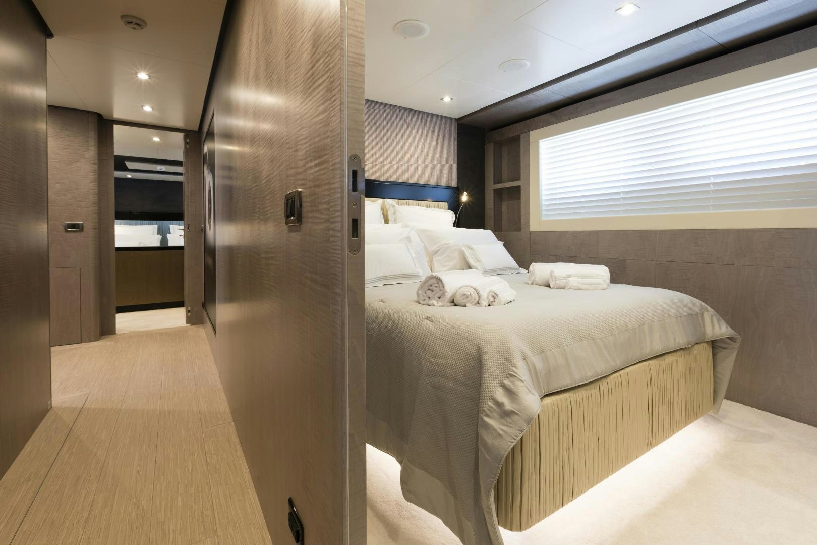 a bedroom with a bed and a closet aboard FRANCESCA Yacht for Sale