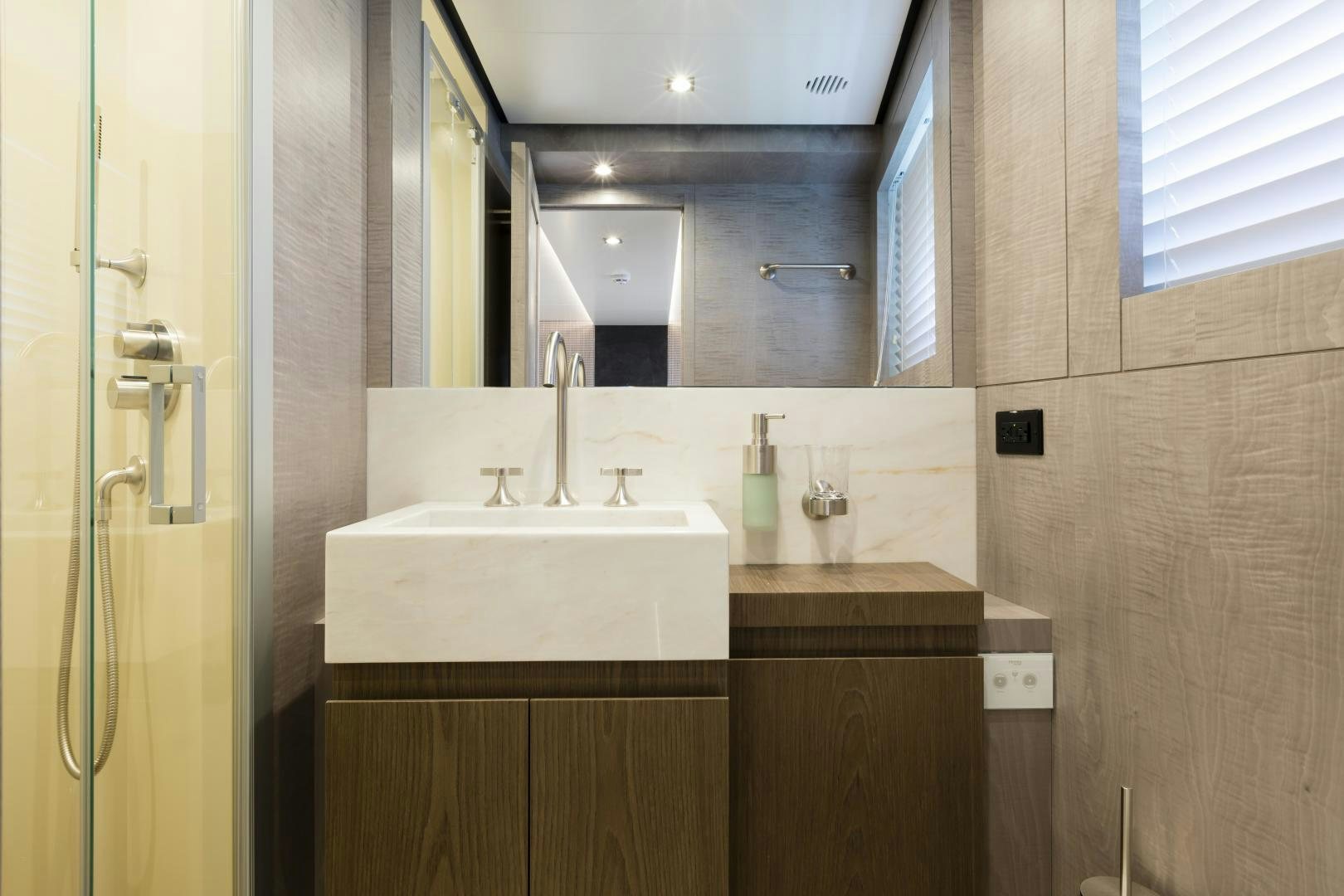 a bathroom with a sink and a mirror aboard FRANCESCA Yacht for Sale