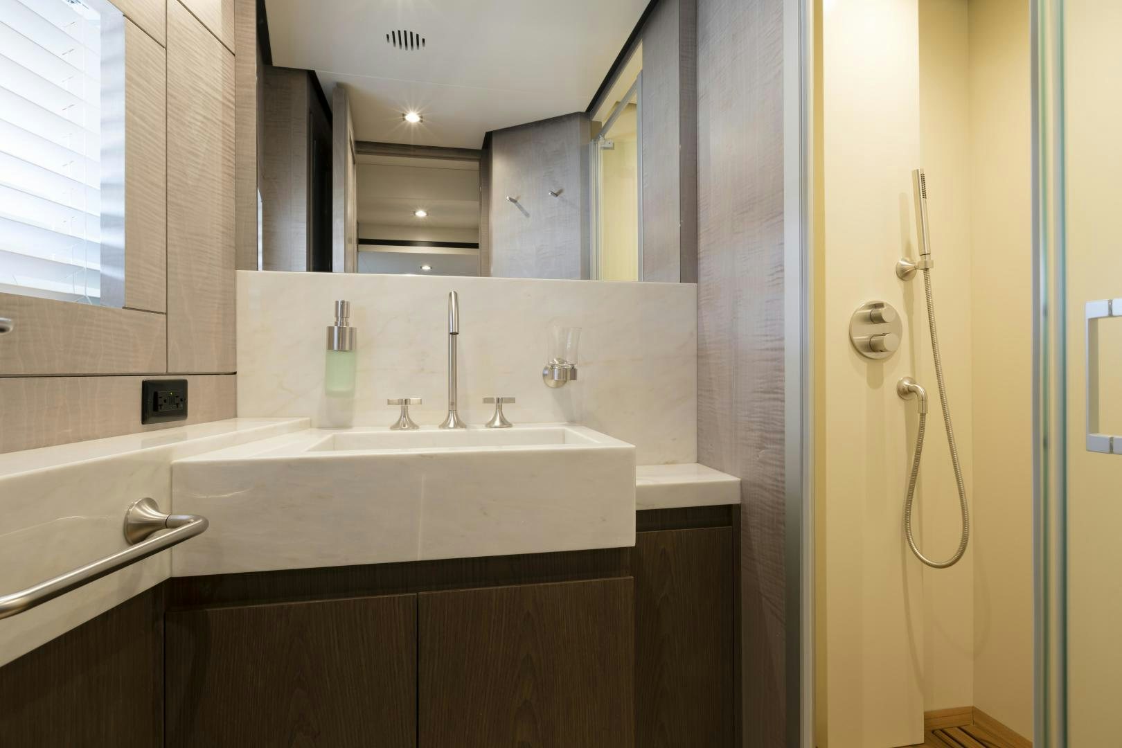 a bathroom with a sink and a mirror aboard FRANCESCA Yacht for Sale
