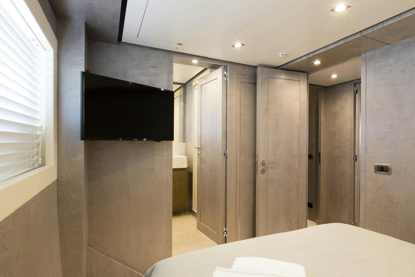 a large bathroom with a large black screen aboard FRANCESCA Yacht for Sale