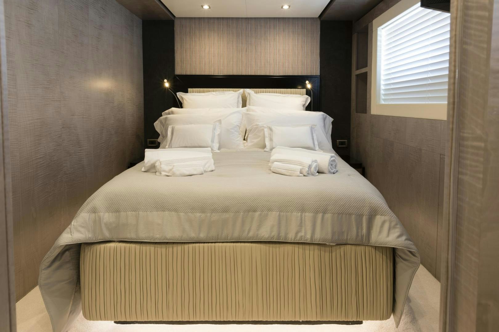 a bed with white sheets aboard FRANCESCA Yacht for Sale