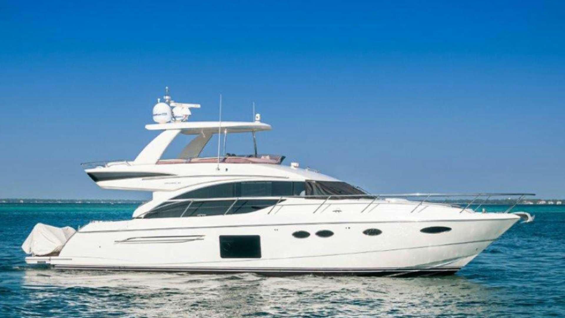 a white yacht on the water aboard PRINCESS ROSE TOO Yacht for Sale