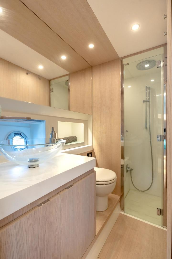 a bathroom with a glass shower aboard CLAIR DE HUNE 2 Yacht for Sale