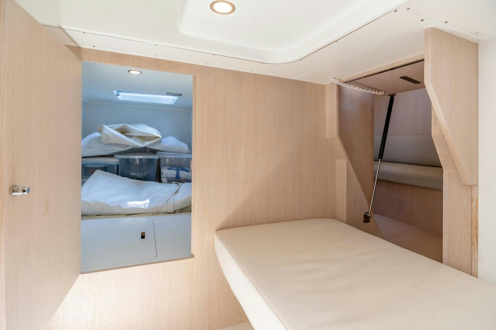 a room with a bed and a closet aboard CLAIR DE HUNE 2 Yacht for Sale