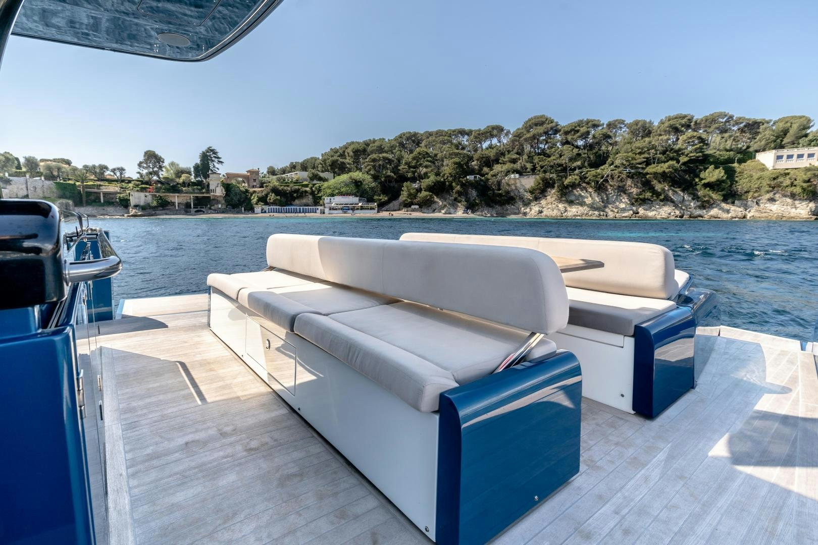 a couch on a deck by a body of water aboard CLAIR DE HUNE 2 Yacht for Sale