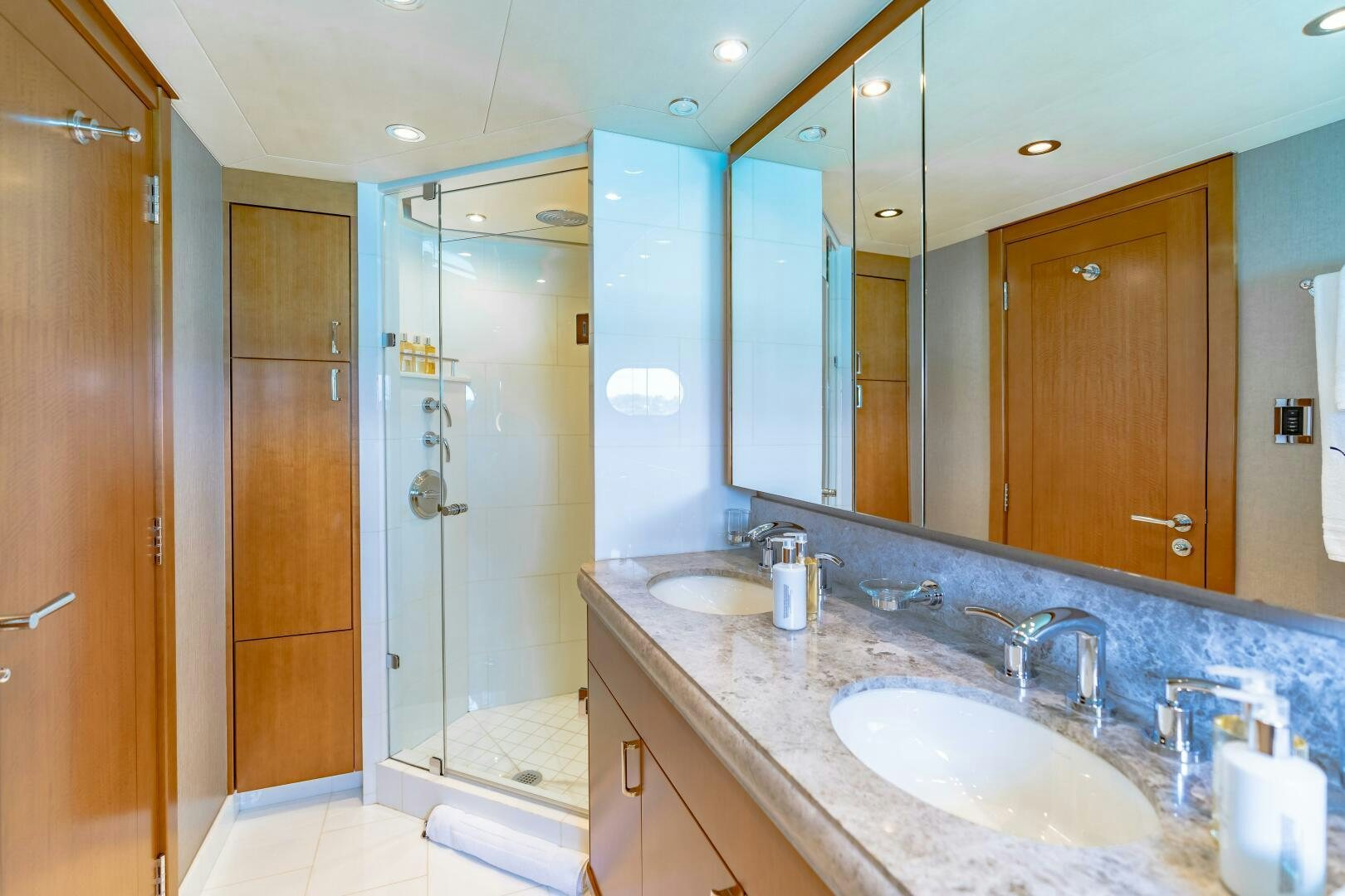 a bathroom with a large mirror aboard FAR NIENTE Yacht for Sale