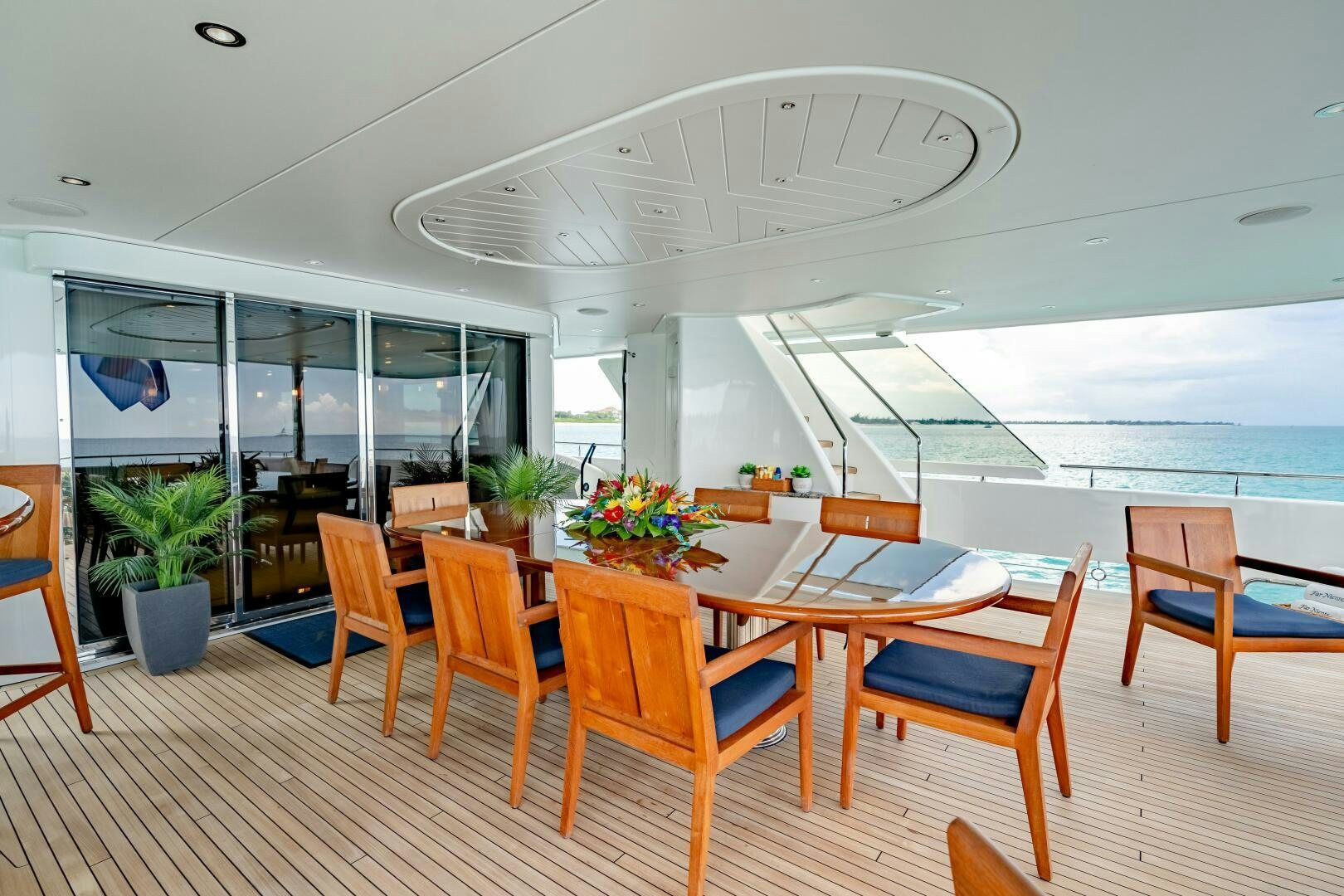 a room with tables and chairs aboard FAR NIENTE Yacht for Sale