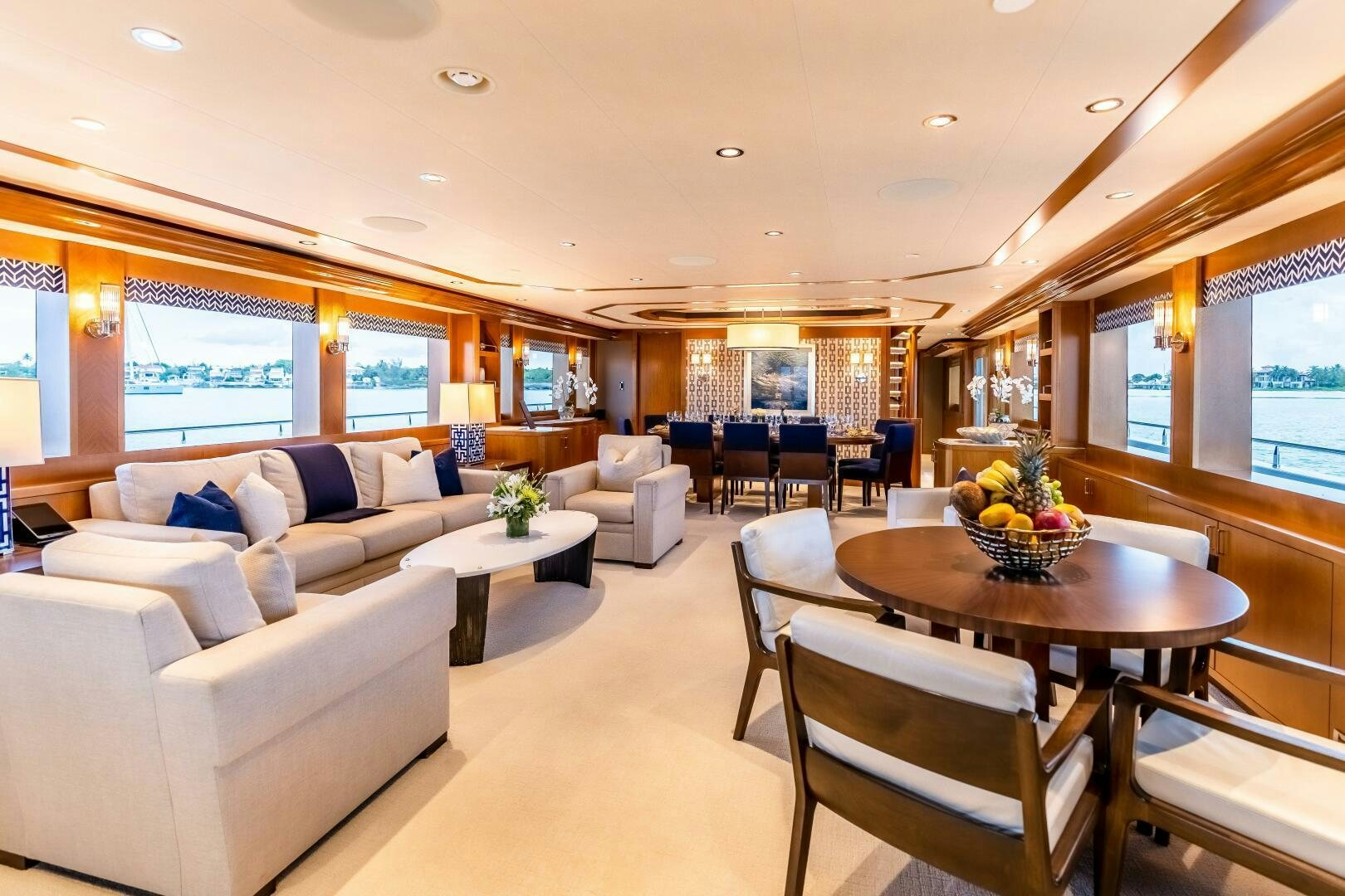 a living room with a table and couches aboard FAR NIENTE Yacht for Sale