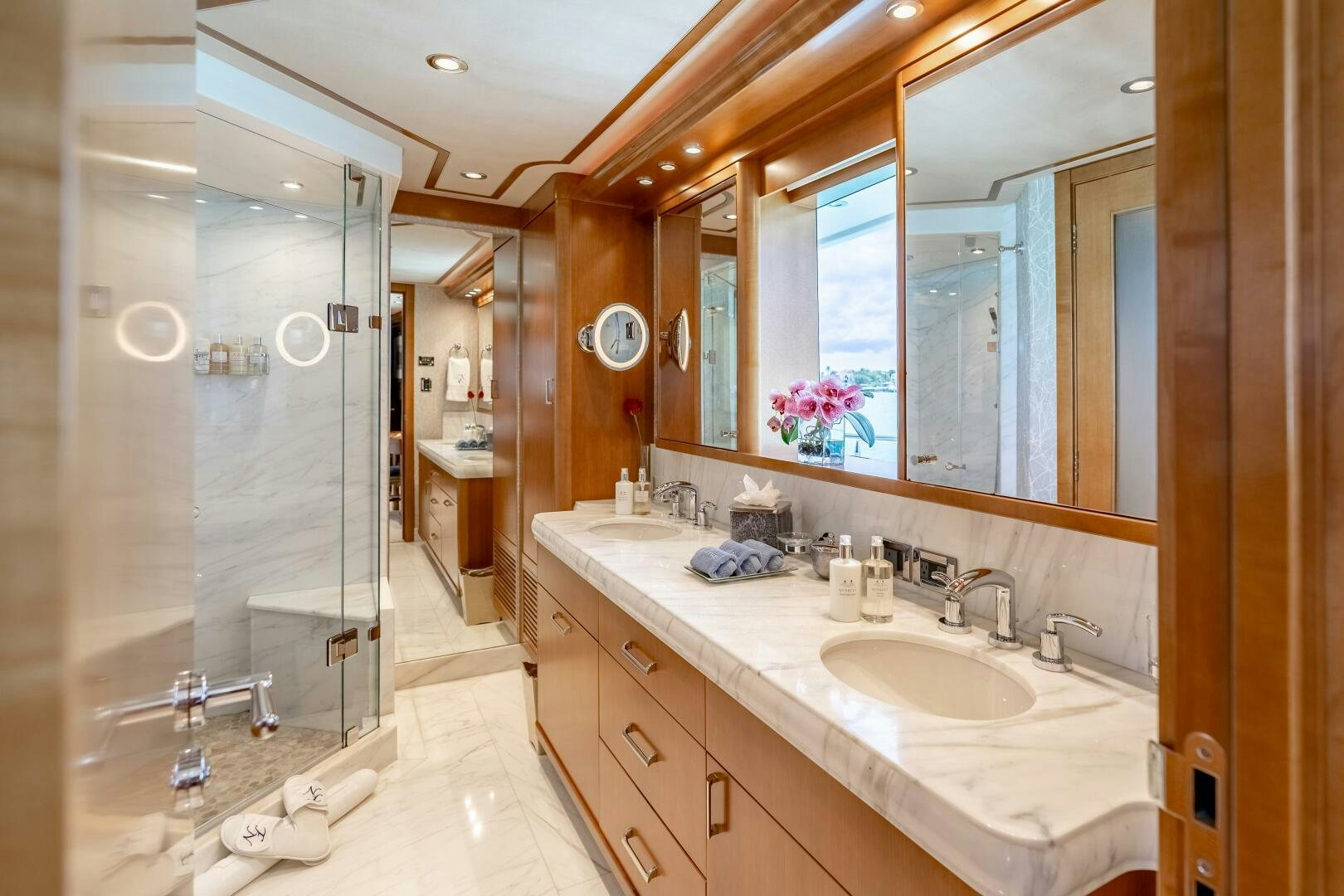 a bathroom with a glass shower aboard FAR NIENTE Yacht for Sale